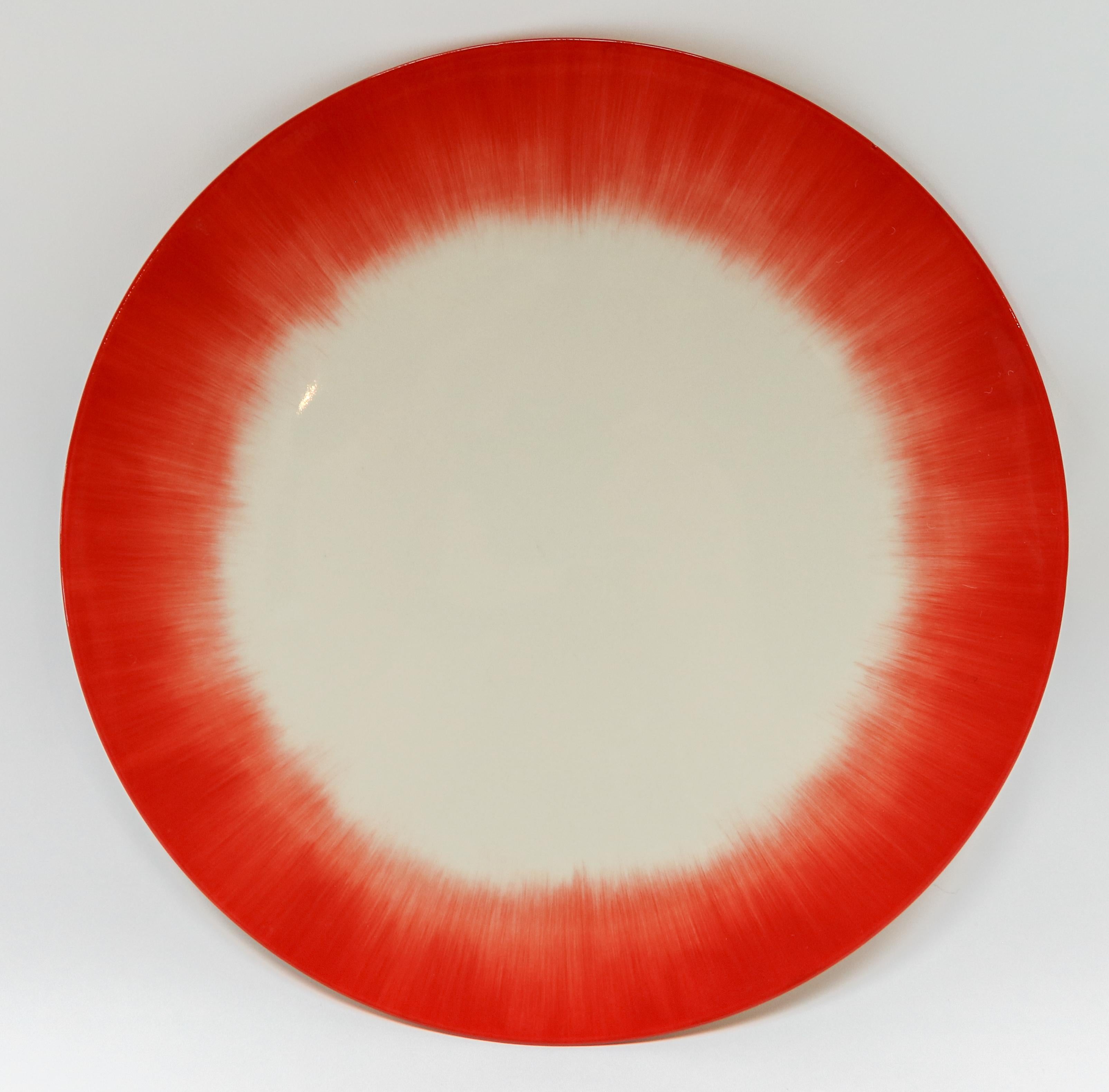 Ann Demeulemeester for Serax Dé dinner plate / charger in off white / red. Hand painted with a starburst pattern. Measures: 28cm diameter x 1.8 cm high. Must be purchased in quantities of two.
