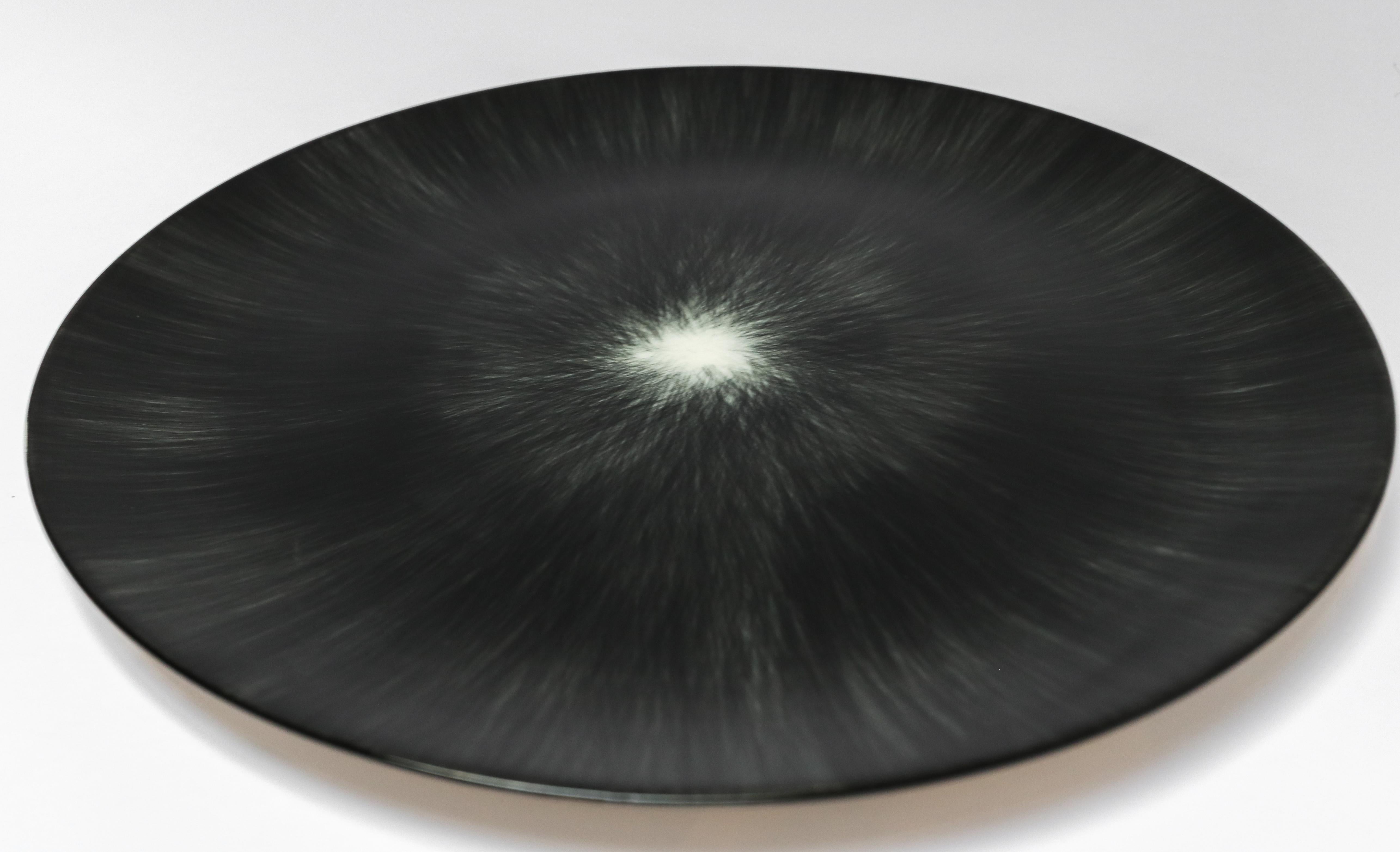 Ann Demeulemeester for Serax Dé dinner plate in black / off white. Hand painted with a starburst pattern. 24cm diameter x 1.1 cm high. Must be purchased in quantities of two.