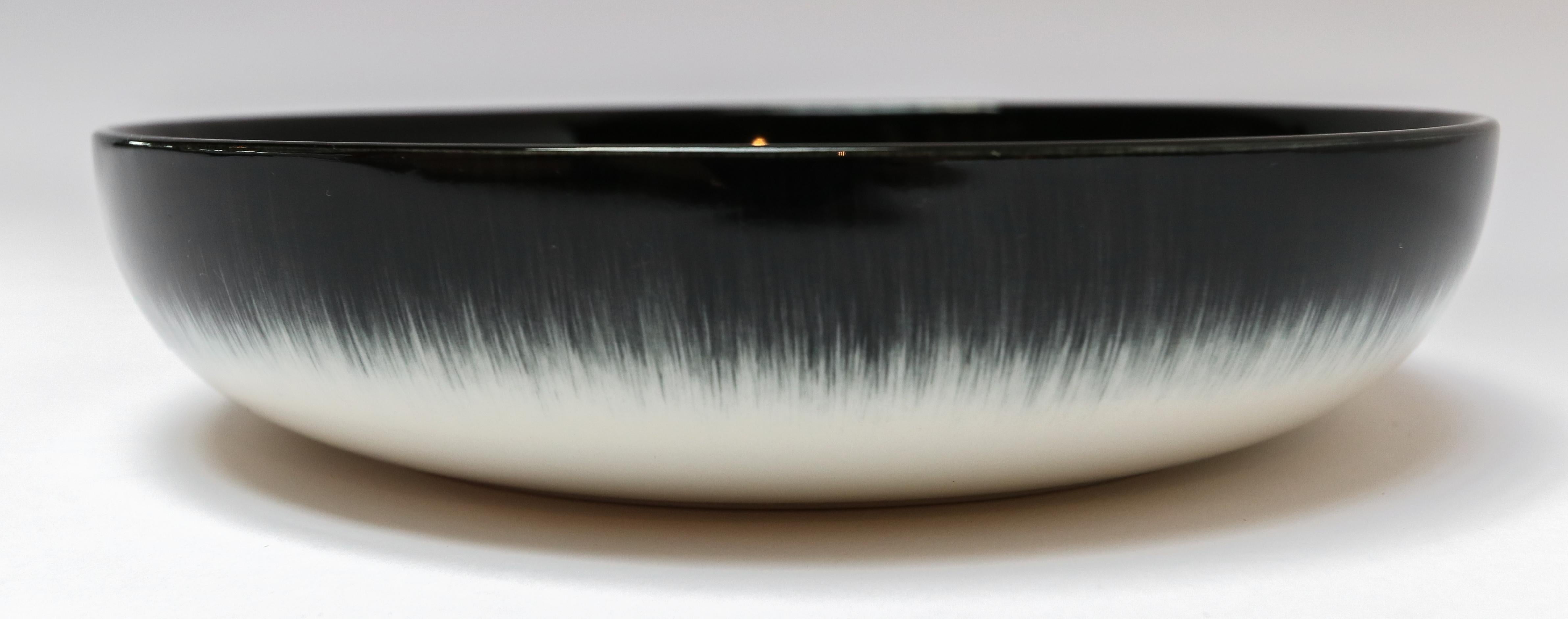 Ann Demeulemeester for Serax Dé medium high plate / bowl in off white / black. Hand painted with a starburst pattern. Measures: 18.5cm diameter x 4.2 cm high. Must be purchased in quantities of two.