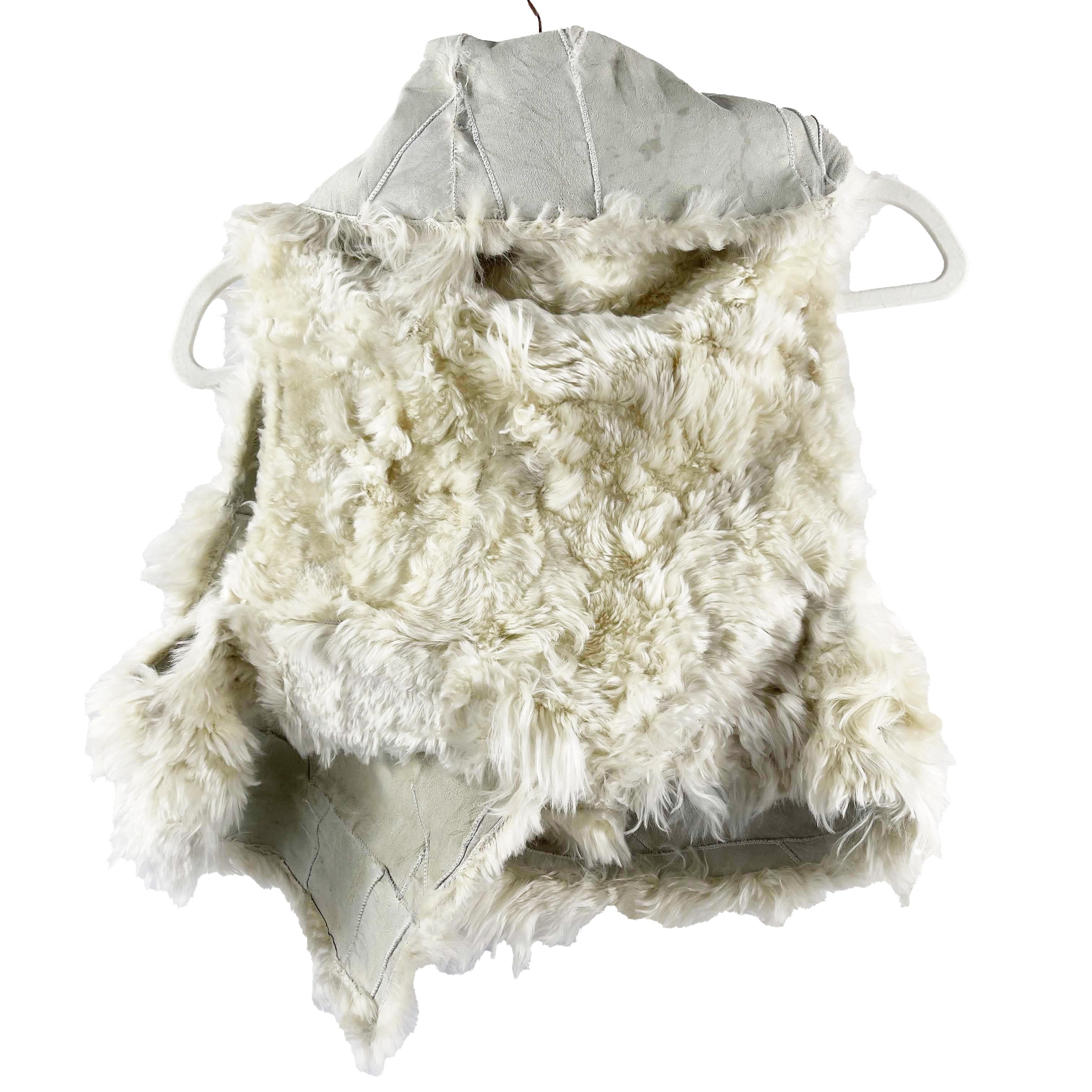 Ann Demeulemeester- Llama Shearling Fur Vest Jacket - Ivory - Size M 

Description

After graduating from the Royal Academy of Fine Arts in the late '80s, Ann Demeulemeester became known as part of the Antwerp Six, a group of radical new designers