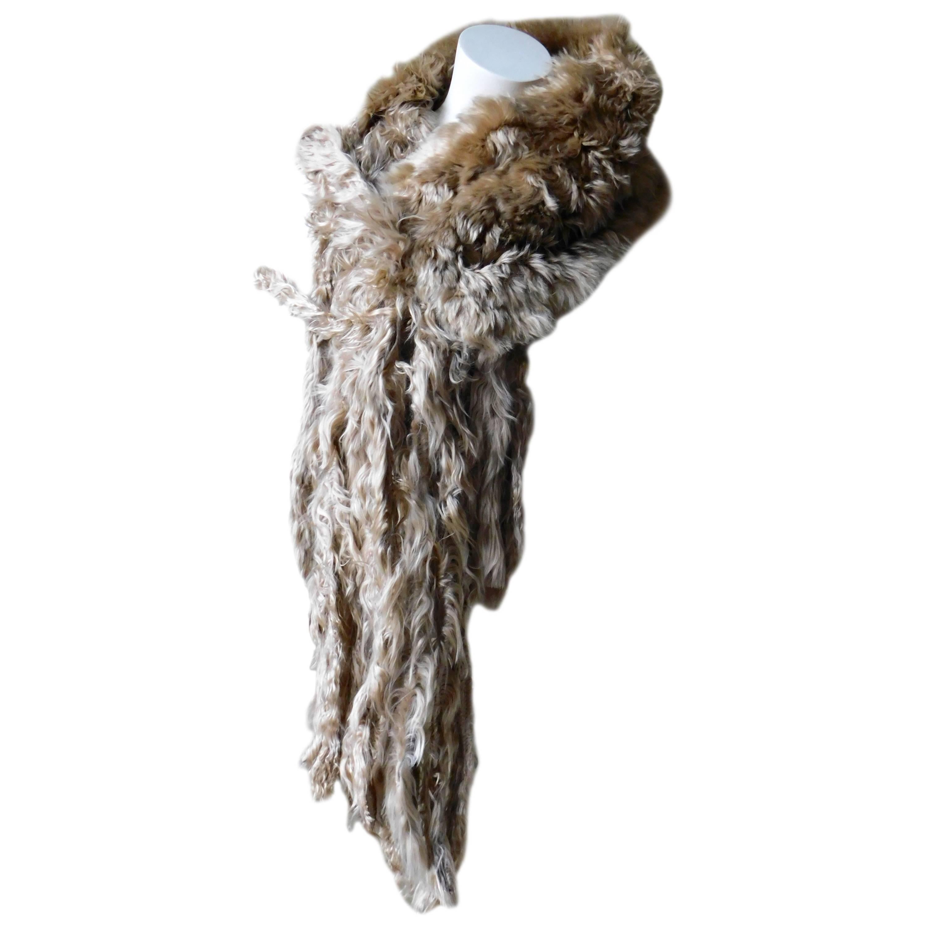 Luxurious unisex llama fur wrap shawl by the edgy Belgian designer 
Ann Demeulemeester.
Very silky soft and luminous in very good condition, the skin is double folded so there is no inside or outside. The long fur fringe makes it possible to tie in