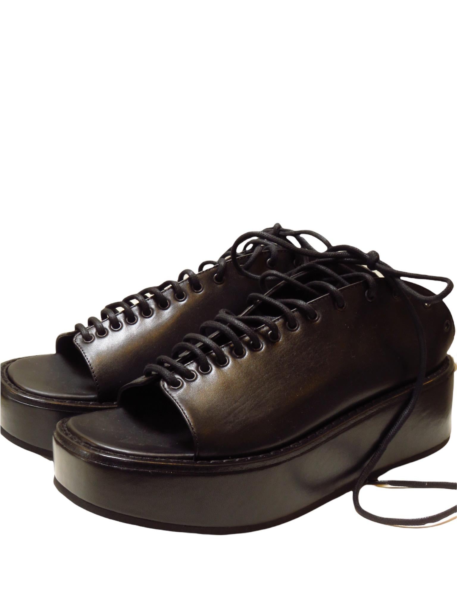 Ann Demeulemeester black platform lace-up leather sandal.