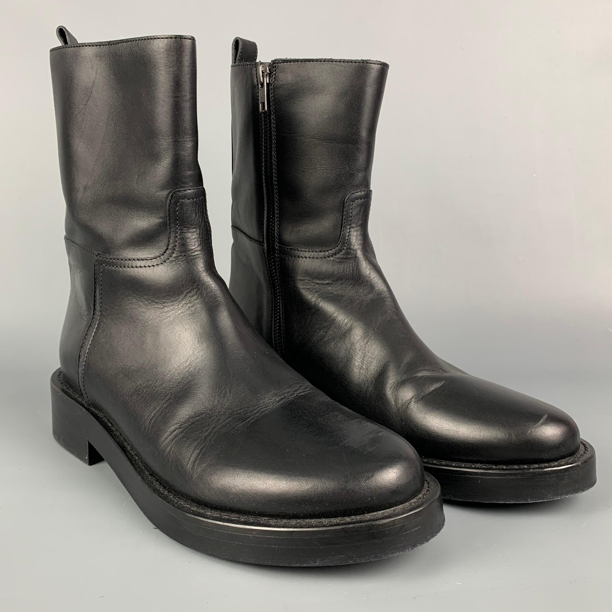 ANN DEMEULEMEESTER boots comes in a black leather featuring a round toe, chunky heel, and a side zipper closure. Made in Italy. 

Very Good Pre-Owned Condition.
Marked: 43

Measurements:

Length: 12 in.
Width: 4.5 in.
Height: 8.5 in. 