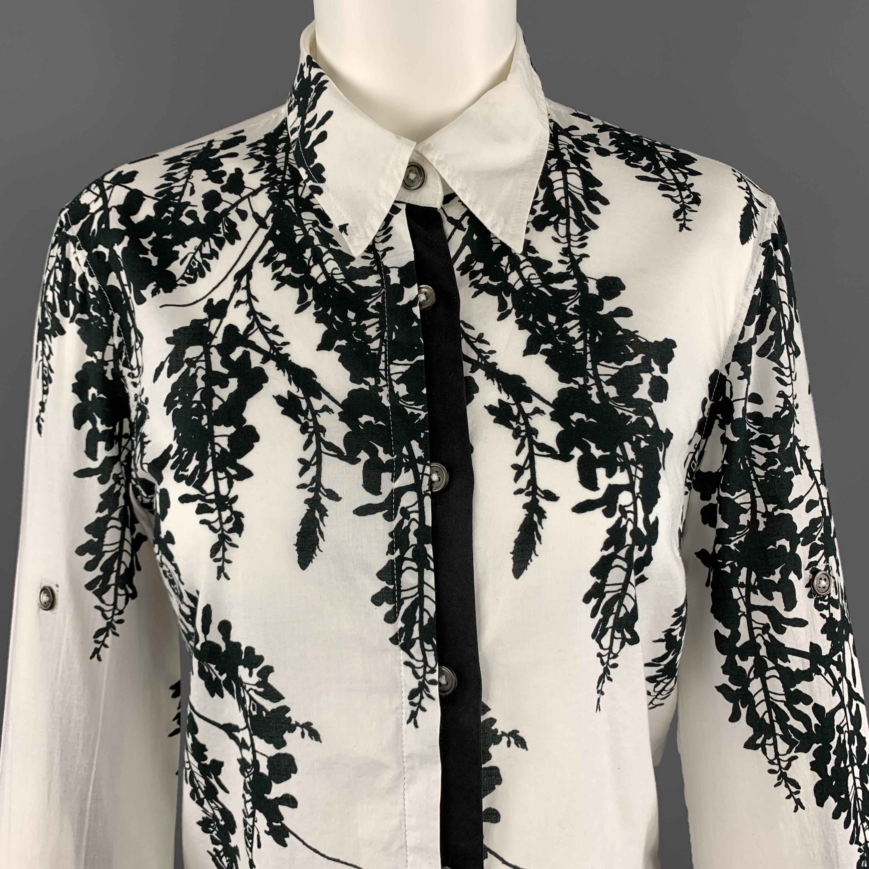 ANN DEMEULEMEESTER shirt comes in white cotton with an abstract black floral print, half placket button front, cropped hem, and sleeves with inner roll up tab and outer button closure. 

Very Good Pre-Owned Condition.
Marked: EU