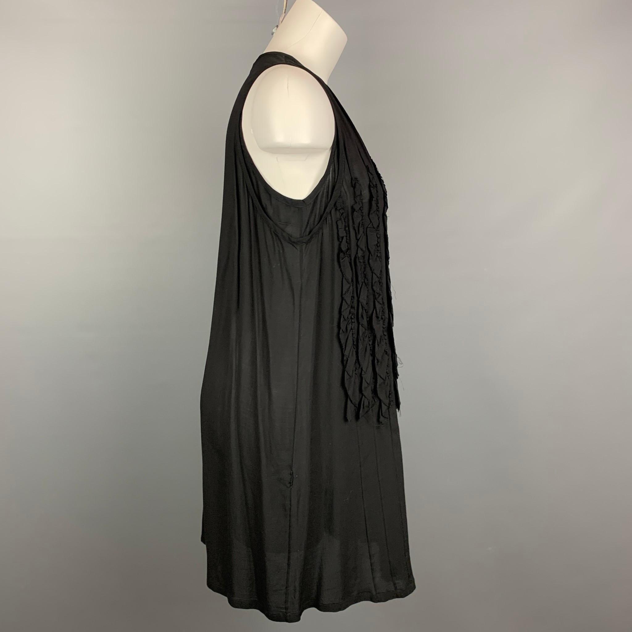 ANN DEMEULEMEESTER sleeveless dress comes in a black sheer material with a front ruffled design featuring a shift style.

Very Good Pre-Owned Condition.
Marked: 36

Measurements:

Bust: 36 in.
Hip: 42 in.
Length: 33.5 in. 