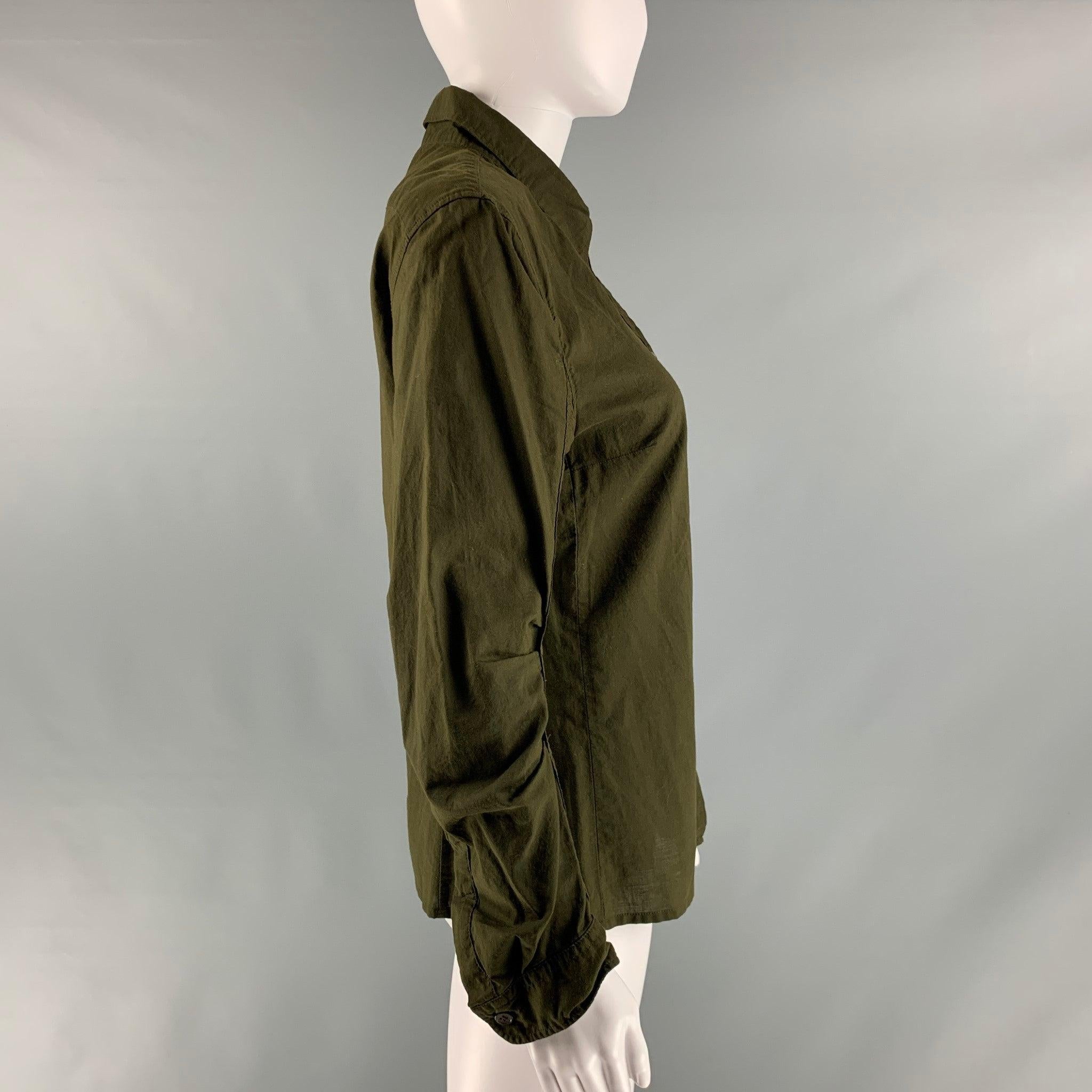ANN DEMEULEMEESTER long sleeve shirt comes in a green olive cotton woven material featuring a rushed details at sleeves, and a button down closure. Made in Belgium.Excellent Pre-Owned Condition. 

Marked:   38 

Measurements: 
 
Shoulder: 16 inches