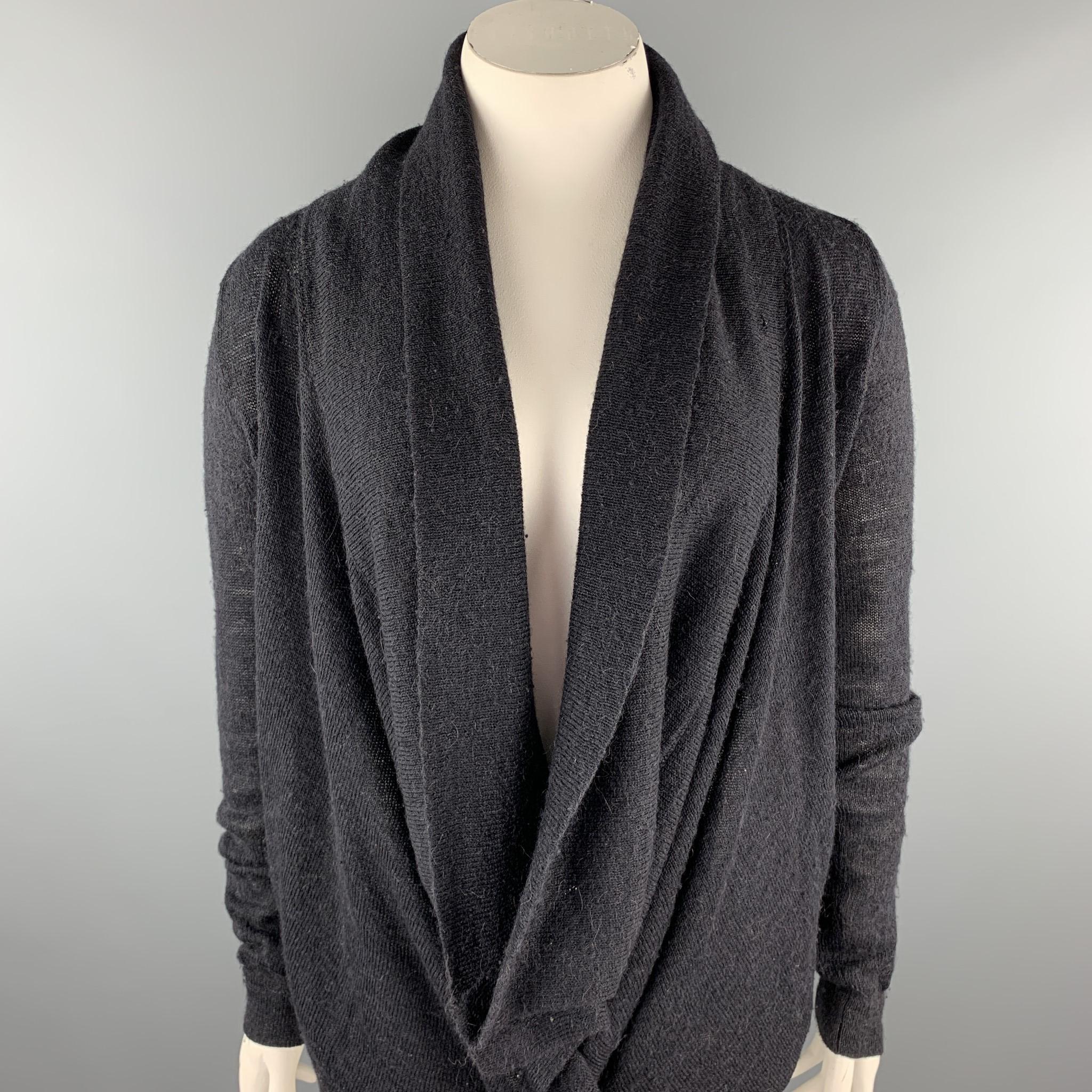 ANN DEMEULEMEESTER cardigan comes in a charcoal knitted alpaca / wool featuring a shawl collar, back straps, and a buttoned closure. 

Excellent Pre-Owned Condition.
Marked: 40

Measurements:

Shoulder: 17 in. 
Chest: 40 in. 
Sleeve: 30 in. 
Length: