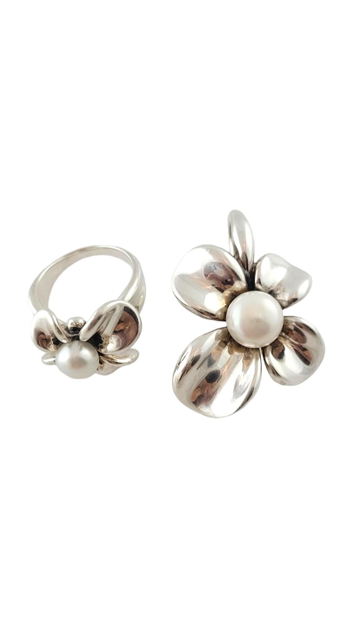 Ann King Sterling Silver Pearl Flower Ring & Pendant Set

This gorgeous set by Ann King features a stunning flower ring with a pearl in the center as well as a flower pendant with a beautiful pearl!

Pearl on ring: 7.95mm
Pearl on pendant:
