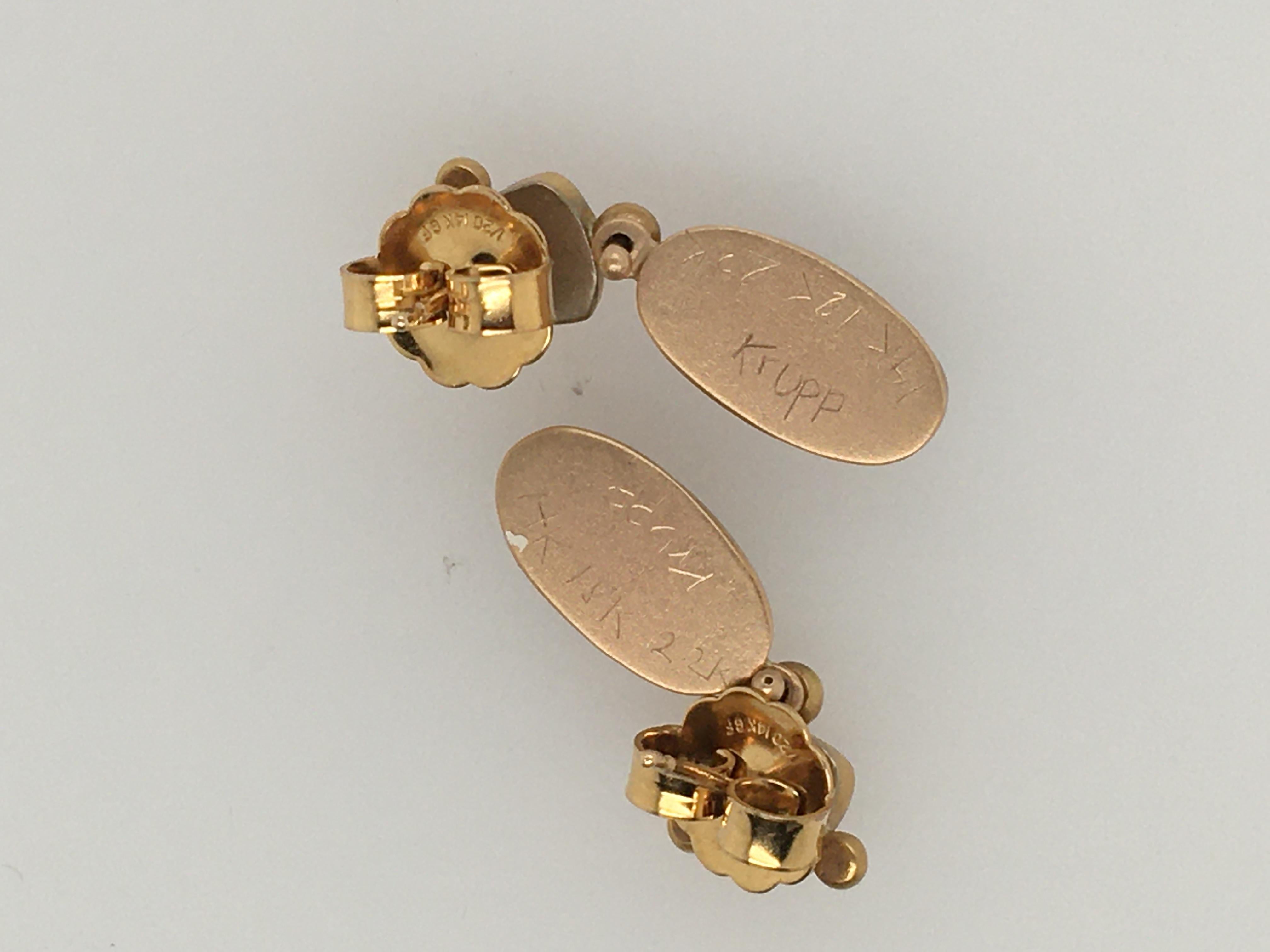 One-of-a-kind pair of Ann Krupp trillion cut orange citrine posts with oval smoky quartz cabochon drops. The November birthstones are bezel-set and accented with three pretty satin finish 18k balls. The citrine is approximately 6mm in diameter; the