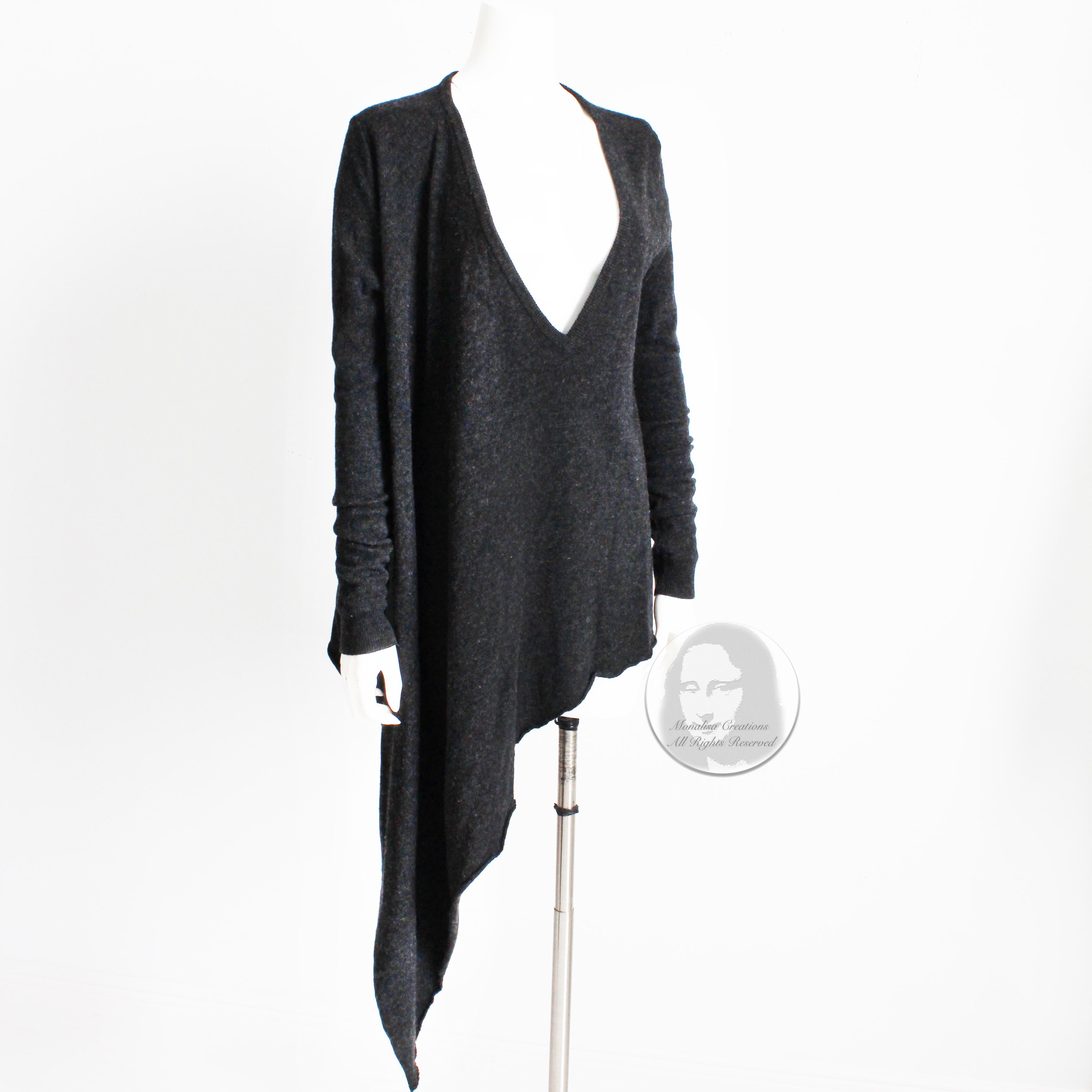This incredible asymmetric wool sweater is from Swedish designer Ann-Sofie Back, circa 2009. Made from 100% wool in a charcoal gray hue, it features a long asymmetric hem & an oversized V-Neck opening. 

Fabulously chic and so easy to style and
