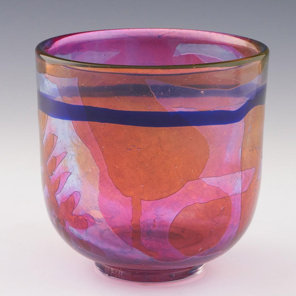 Heading : Kosta Boda footed bowl designed by Ann Warff
Date : Signed 1973
Origin : Kosta, Sweden
Bowl Features : Externally a blue band across a clear glas casing with a crackle and bublle effect. Internally peach glass is cut to different levels