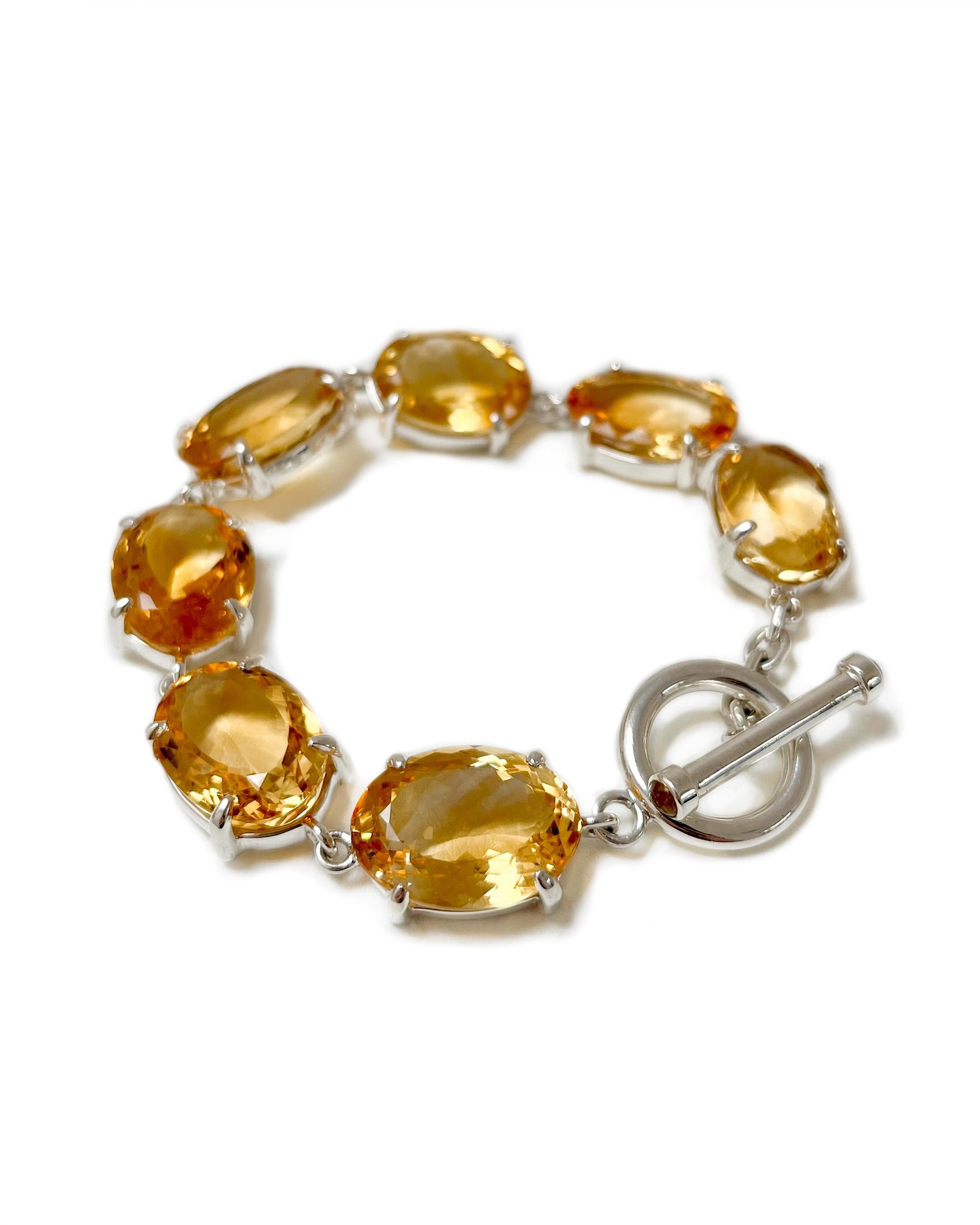 Intention: ﻿Like Candy 

Design: Large marigold oval citrine stones wrap your wrist and radiate like the sun. This bracelet gives you a perfect pop of color, day or night. There's a toggle clasp for an easy but secure closure, and the stones are set