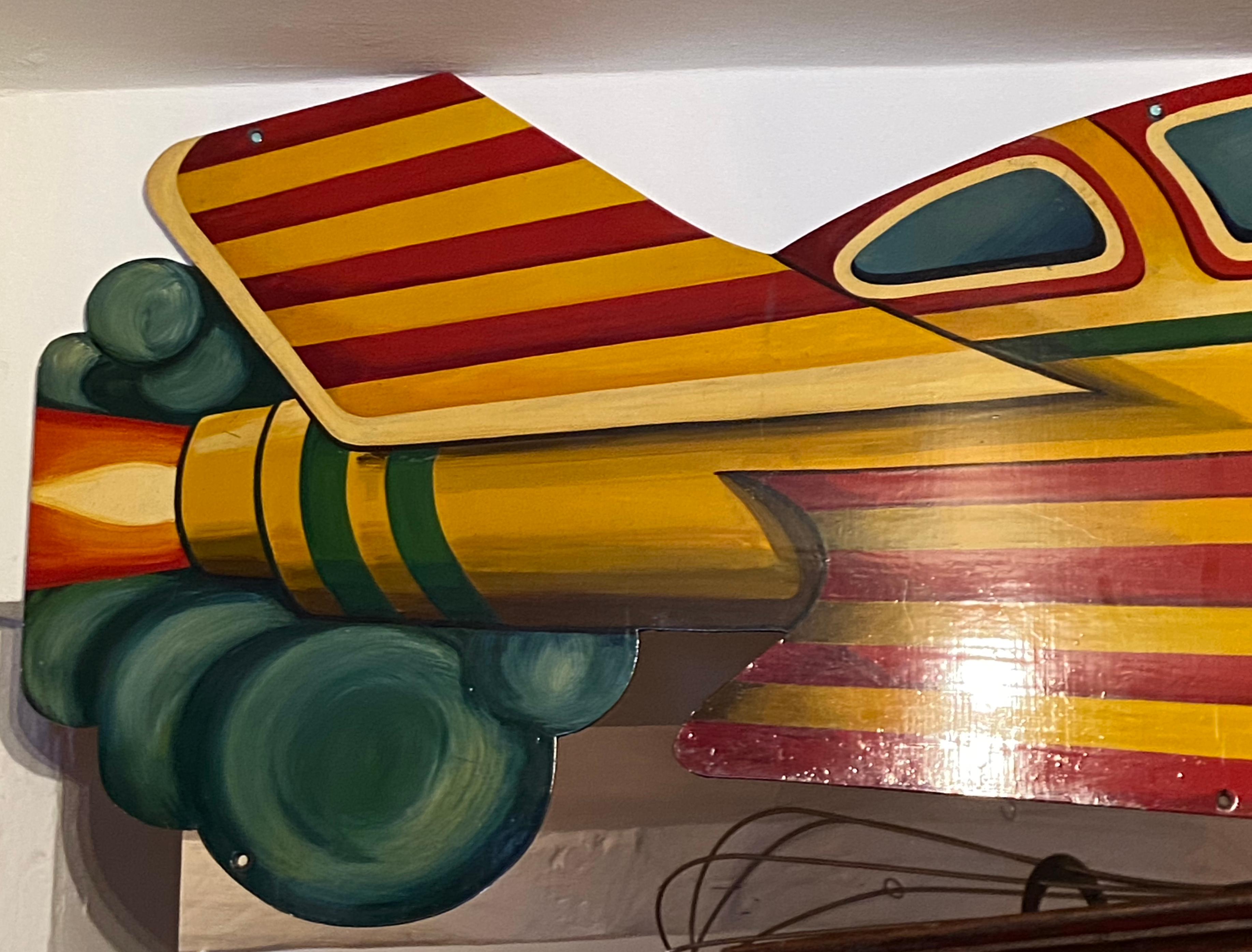 Wonderful metal hand painted Spaceship, Racing Aircraft by Anna Carter, signed and dated 1997.

Carters steam fair is a traditional English travelling funfair with rides dating from the 1890s-1960s. The Carters soon became known as specialists in