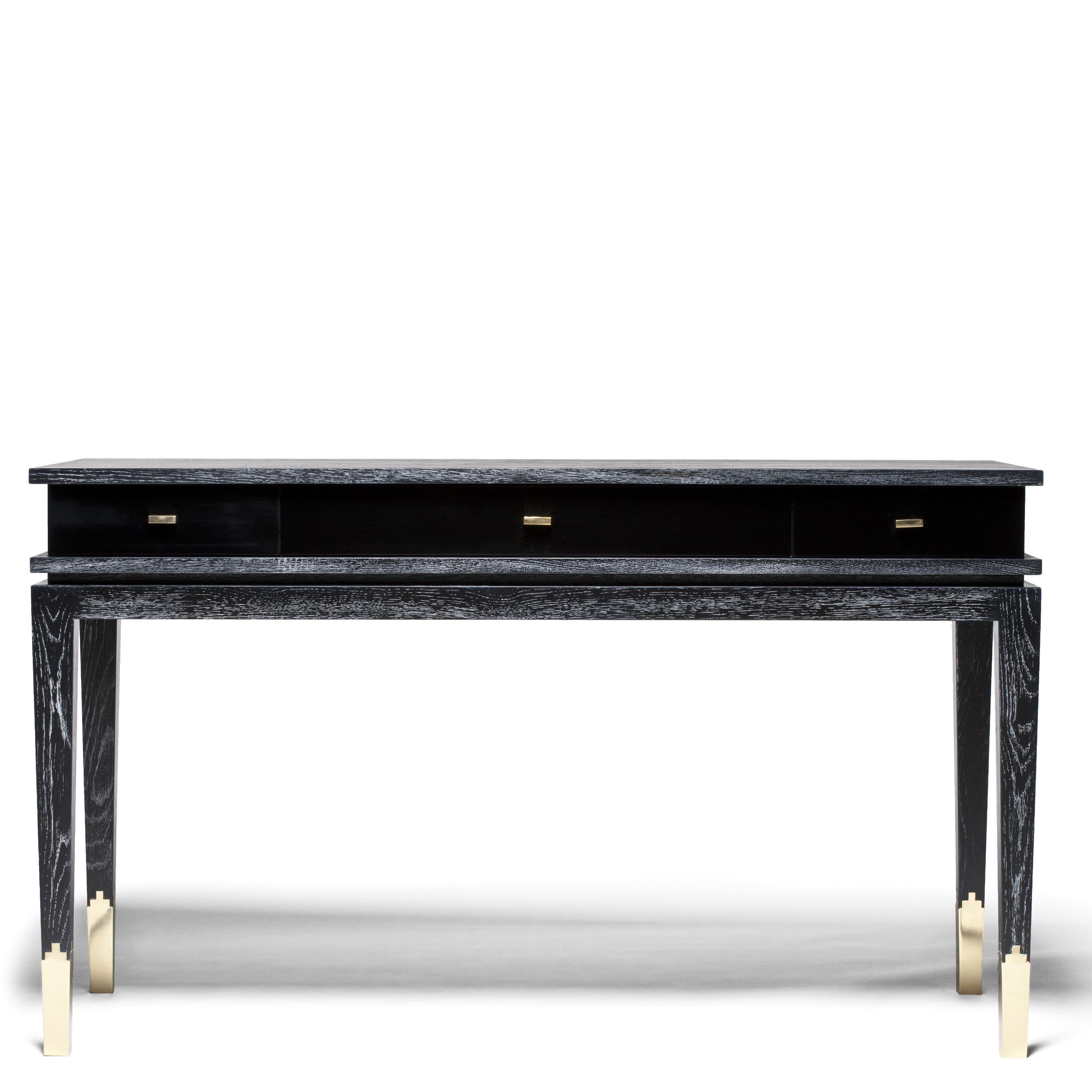 Anna Console by DUISTT 
Dimensions: W 130 x D 55 x H 77 cm
Materials: Black Limed Oak, Satin Black Lacquered Wood and Brass

Anna is an elegant console, crafted with great attention to details, that features a beautiful structure in oak with a limed