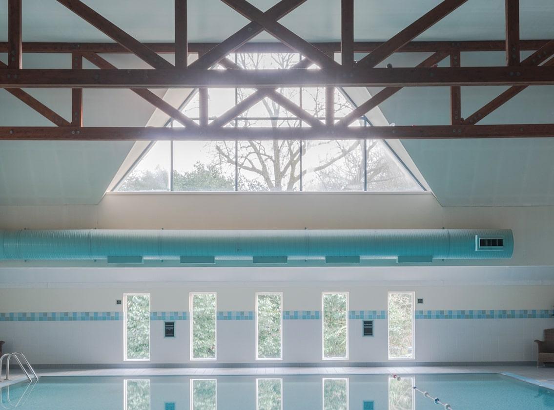 Architectural photo of a pool in British hotel. White frame, museum glass - Photograph by Anna Dobrovolskaya-Mints