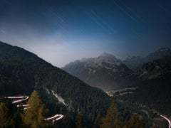 Maloja Pass in Switzerland by Anna Dobrovolskaya-Mints. Night photo, star trails