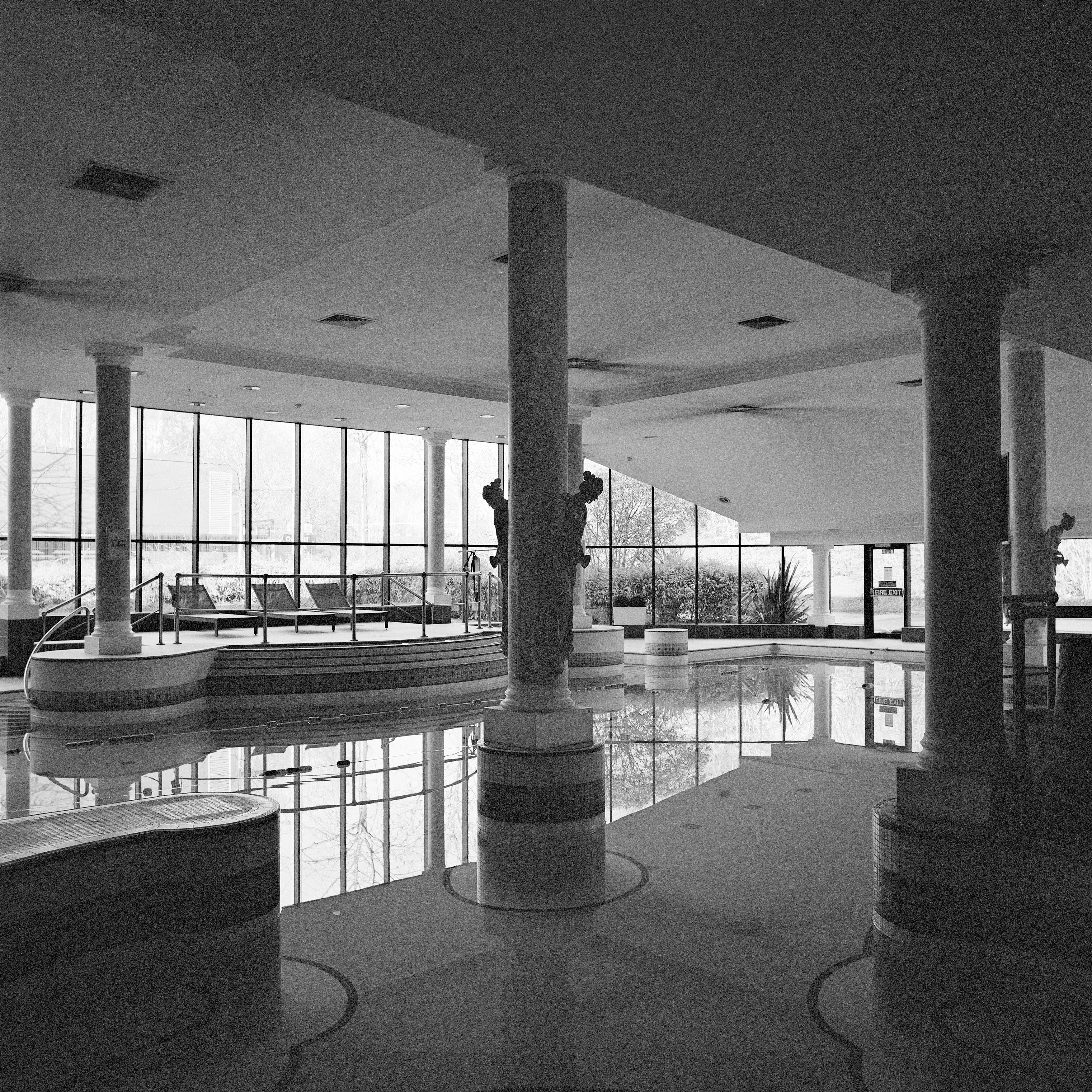 Anna Dobrovolskaya-Mints Black and White Photograph - Monochrome Square Architecture Photography: Empty Swimming Pool Design.