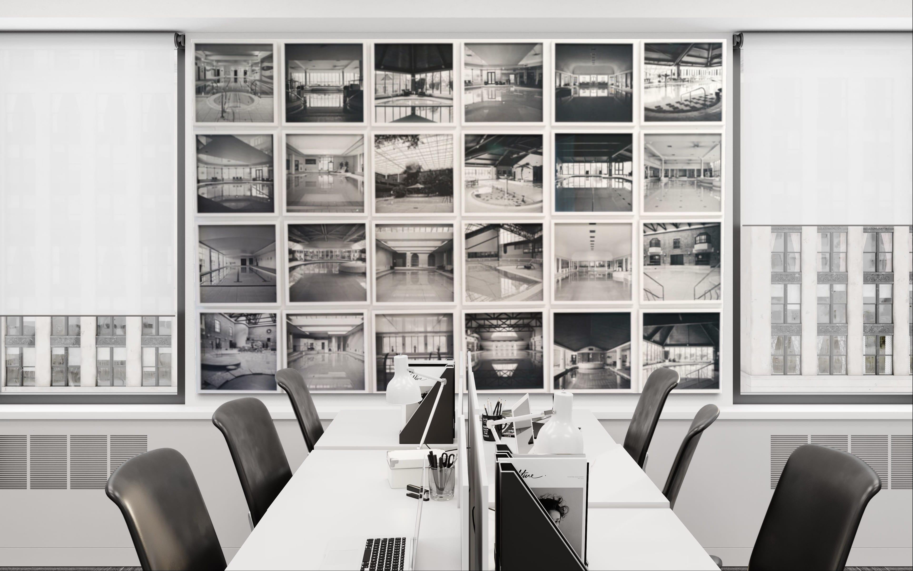 Large panel of black and white architecture photos in white frames with glass For Sale 4