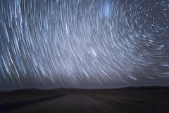 Star trails in Namibian desert. Color night photo by Anna Dobrovolskaya-Mints