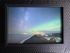 Starry sky and Northern Lights in Iceland. Green color, small framed photo