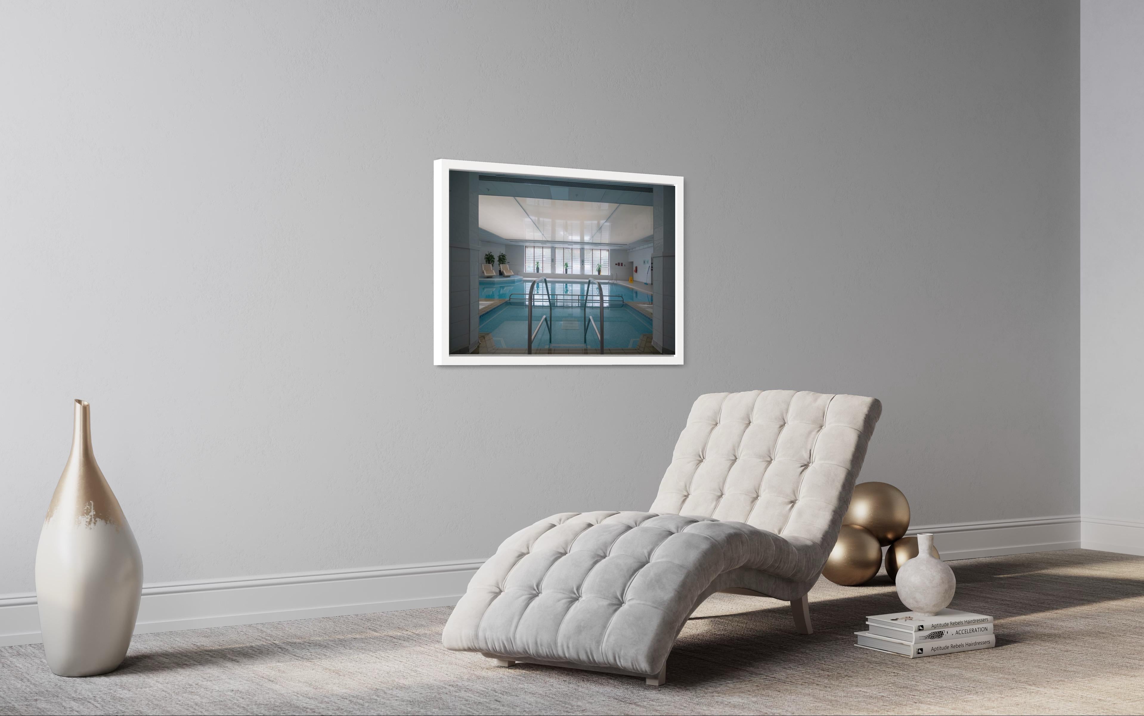 Architectural photo of a pool in a hotel in Wiltshire. White frame, museum glass - Contemporary Photograph by Anna Dobrovolskaya-Mints