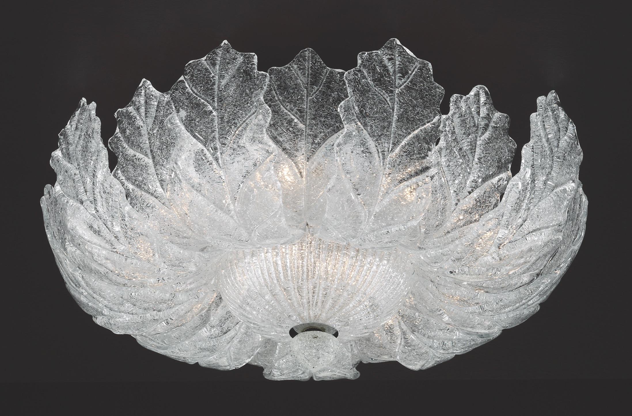 Italian flush mount with clear Murano glass leaves hand blown in Graniglia technique to produce a granular textured effect, mounted on chrome finish metal frame by Fabio Ltd / Made in Italy
11 lights / E12 or E14 type / max 40W each
Measures:
