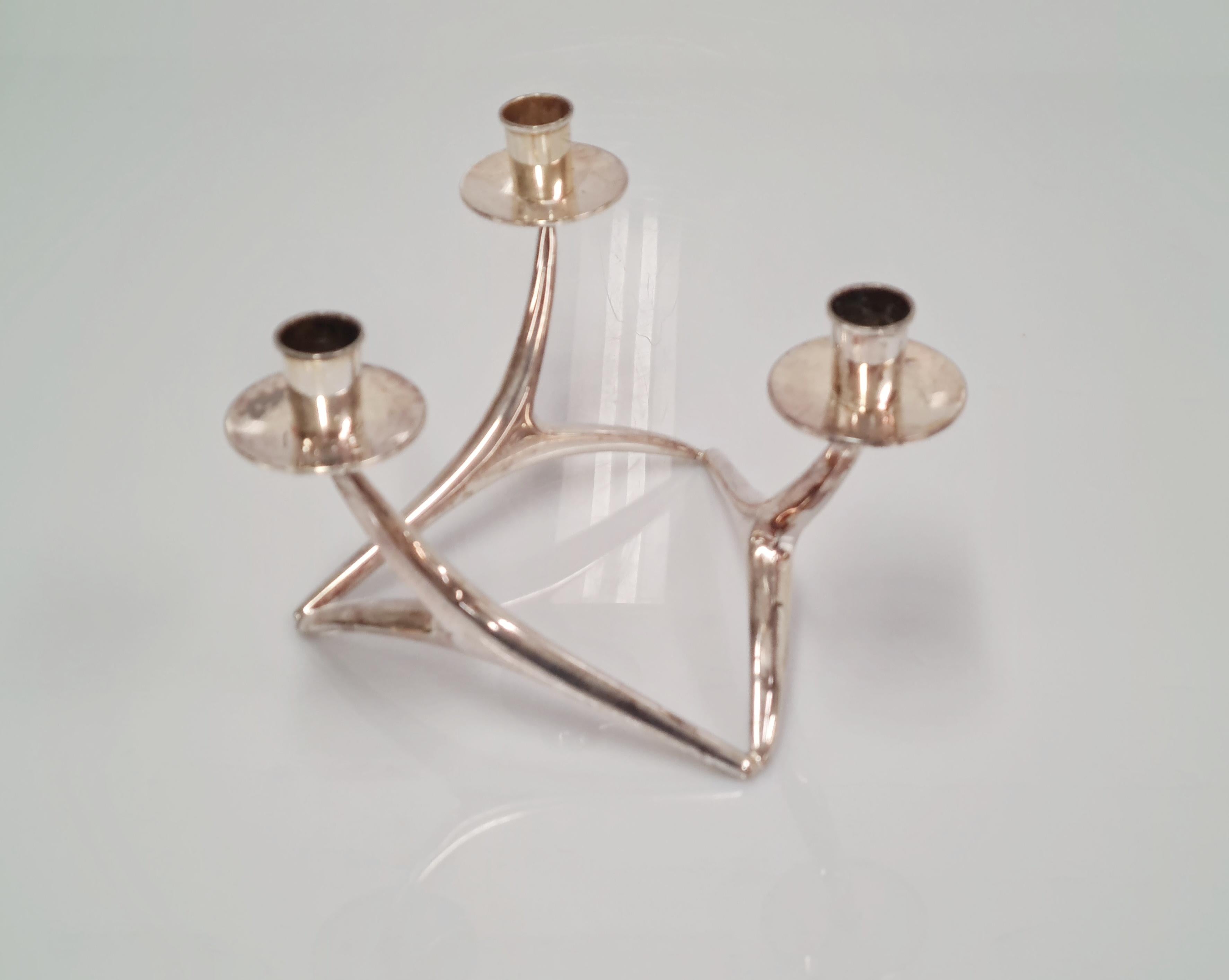 A very beautiful candleholder designed by Anna Greta-Eker. This piece is a part of a very well known series of candle holders in different sizes and shapes but in this similar distinctive design by Anna Greta-Eker. This one in particular is amongst