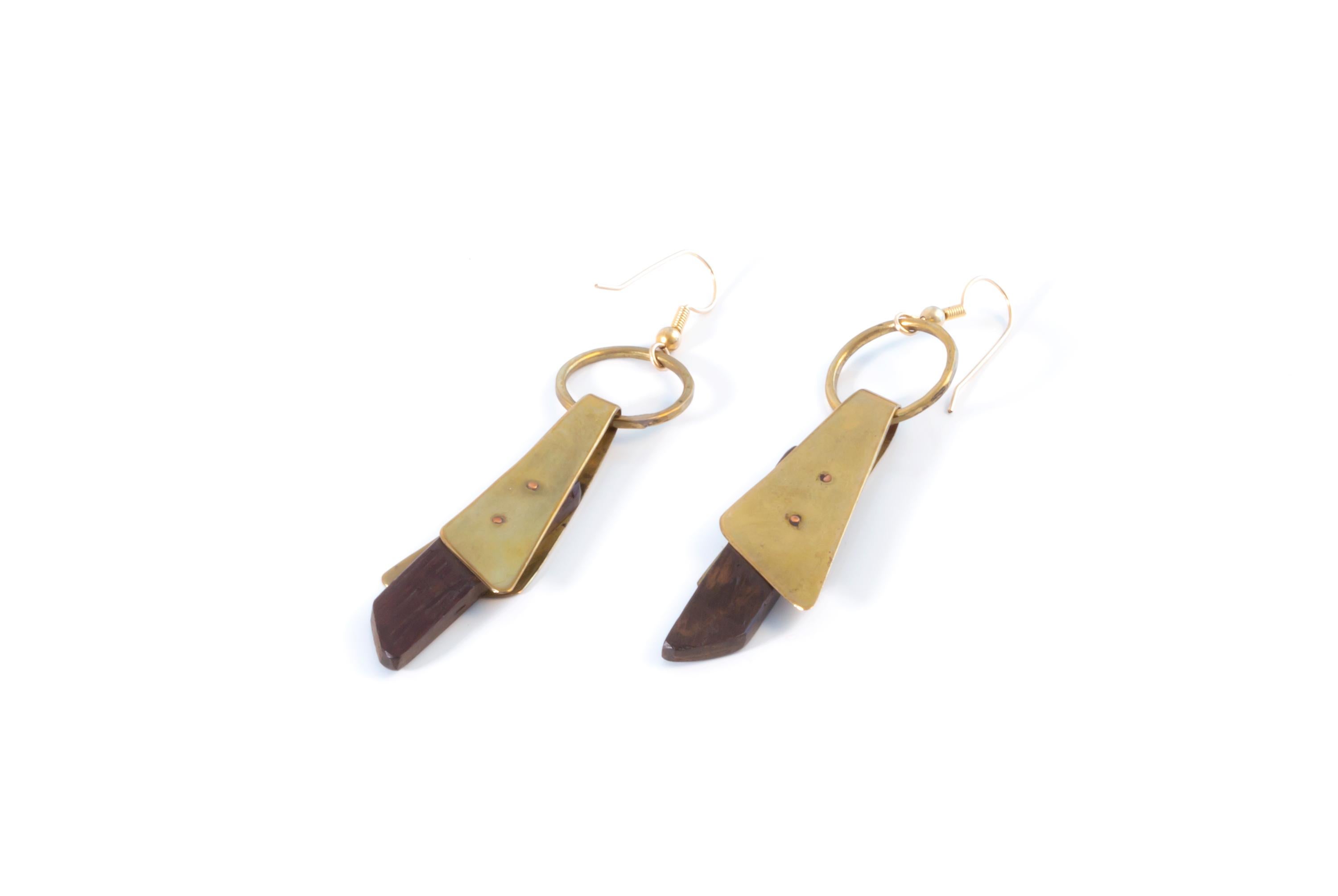 Sculptural earrings in brass and lacquered oak. Custom made in her studio as a one off pair by Anna Greta Eker, ca 1970 first half. Both earrings are in very good vintage condition, with no imperfections.