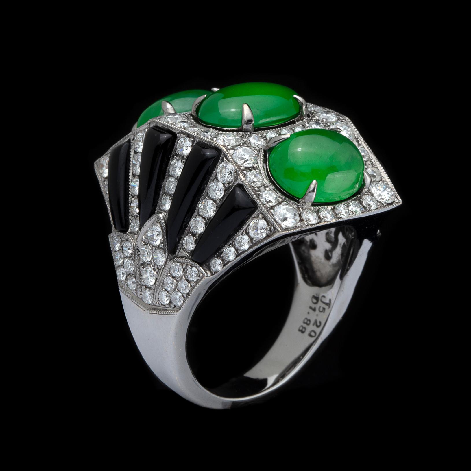 Exclusive New York-based Taiwanese jeweler Anna Hu created this amazing ring. The fan-shaped 18k white gold ring is designed with 3 oval-shaped jadeite jade cabochons, weighing together 5.20 carats, and accented with black onyx and round