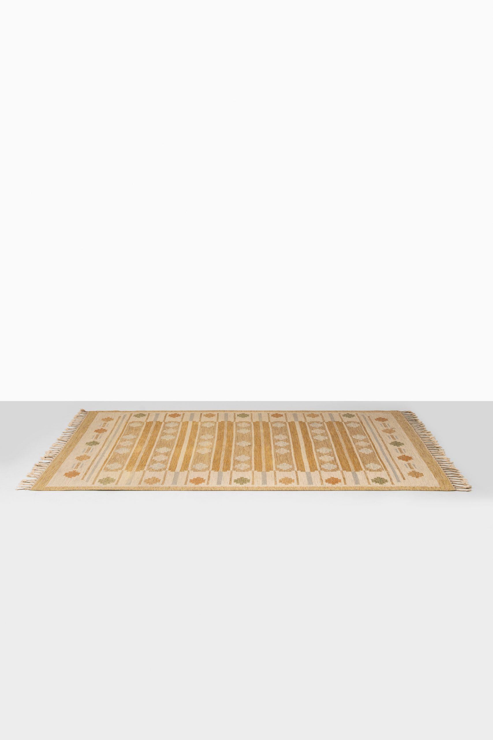 Rare flat-weave carpet designed by Anna Johanna Ångström. Produced in Sweden. Signed Å.