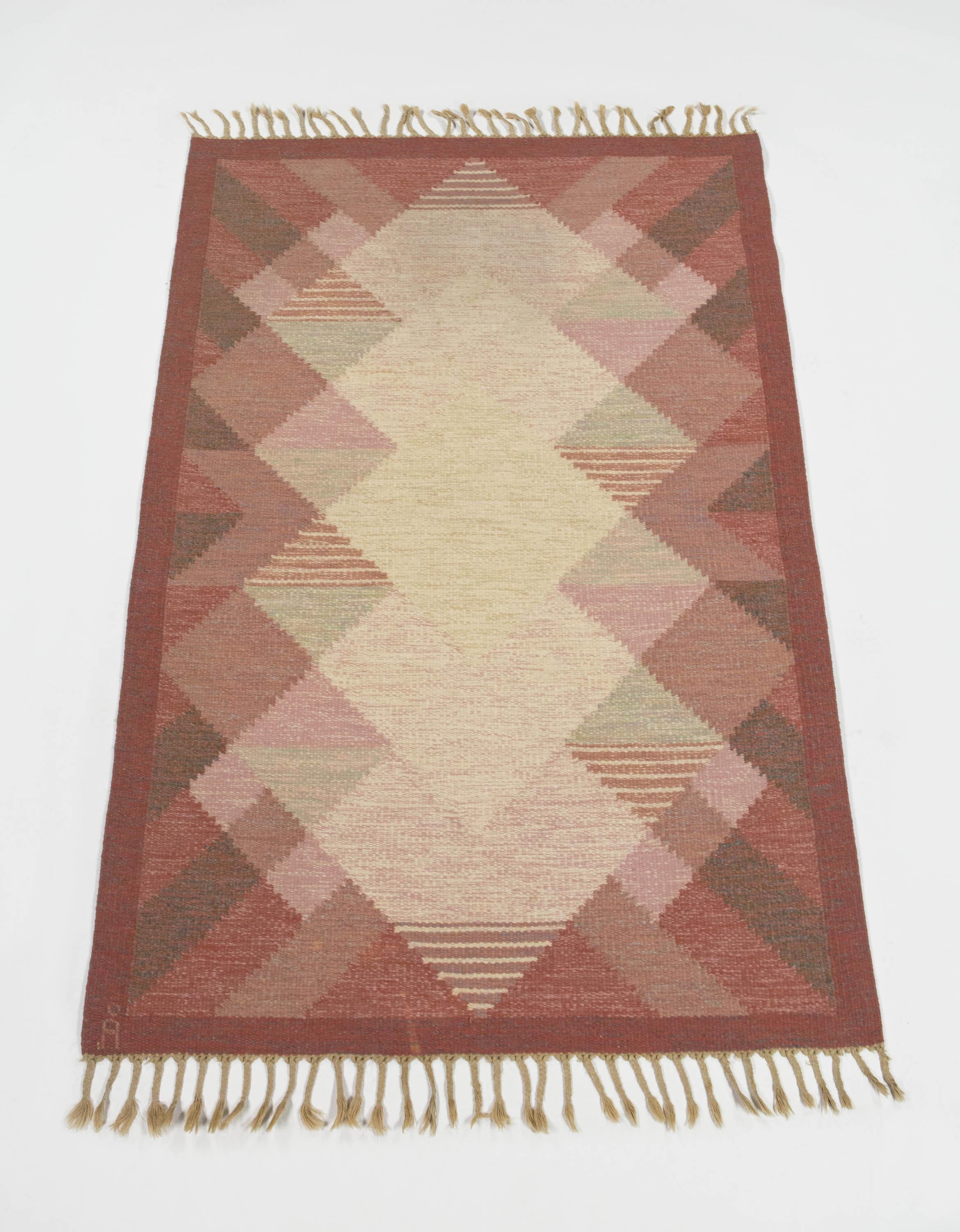 Anna Johanna A°ngstro¨m Swedish Ro¨lakan rug with pink Geometric pattern 1960's

Signed 