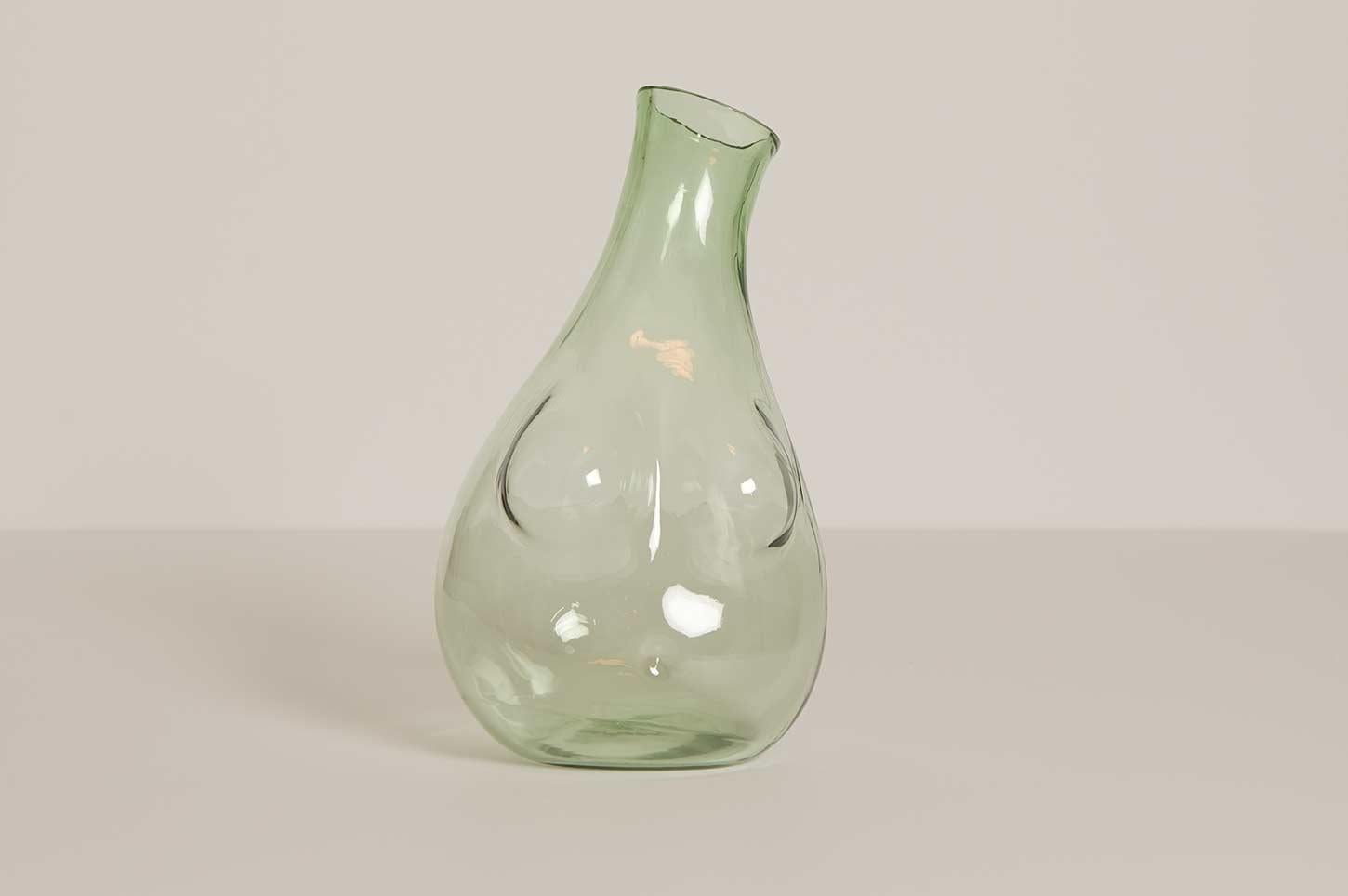 Made from hand-blown glass to hold water, wine or anything you else you fancy.

Capacity: 1750ml / 60 oz. When ordering, please specify clear or green glass.