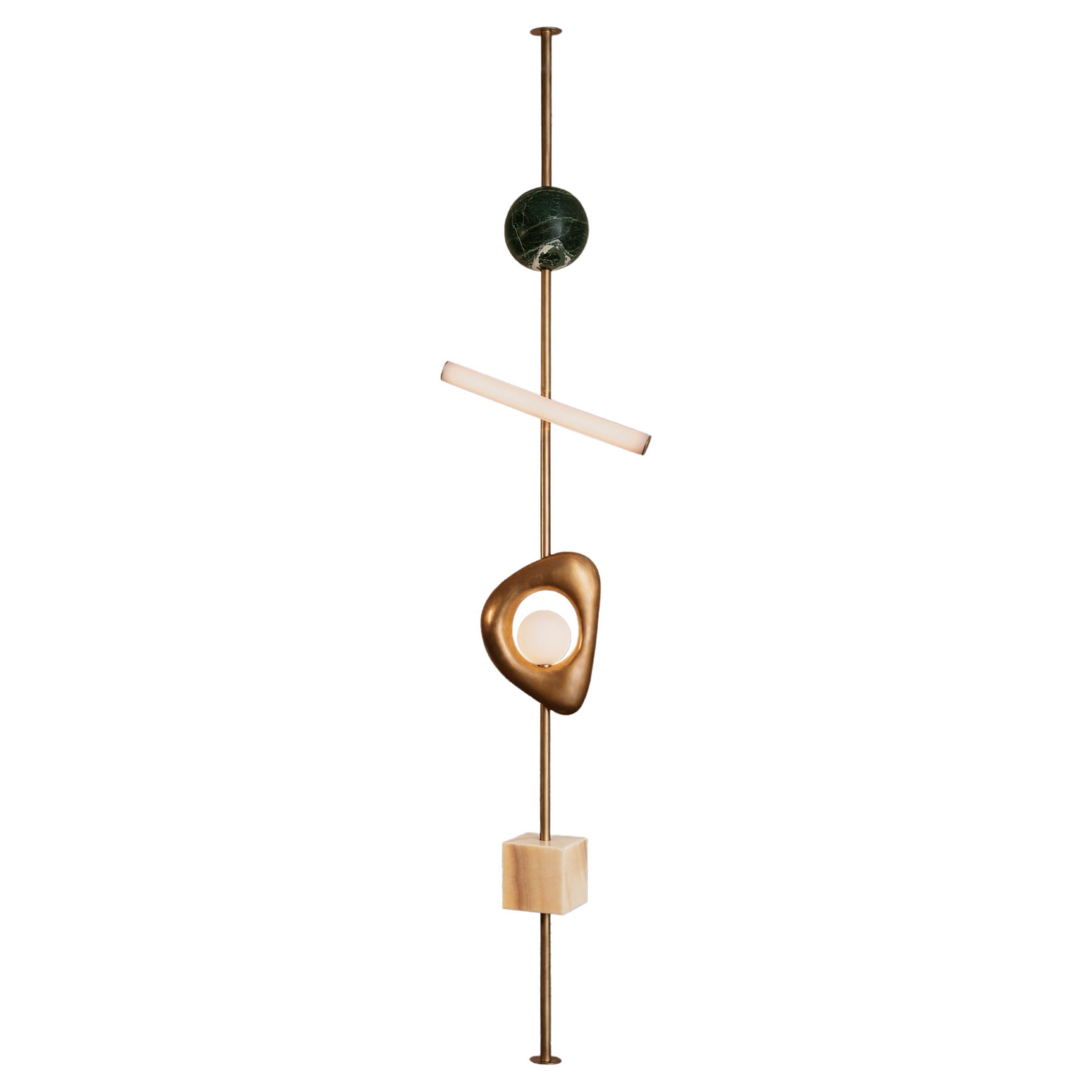 Carved travertine and handblown glass works stretch between floor and ceiling. It is both sculpture and light-giving. The height of each Form is tailored to fit perfectly in any space. Available as a plug-in from top or bottom, please inquire.

This
