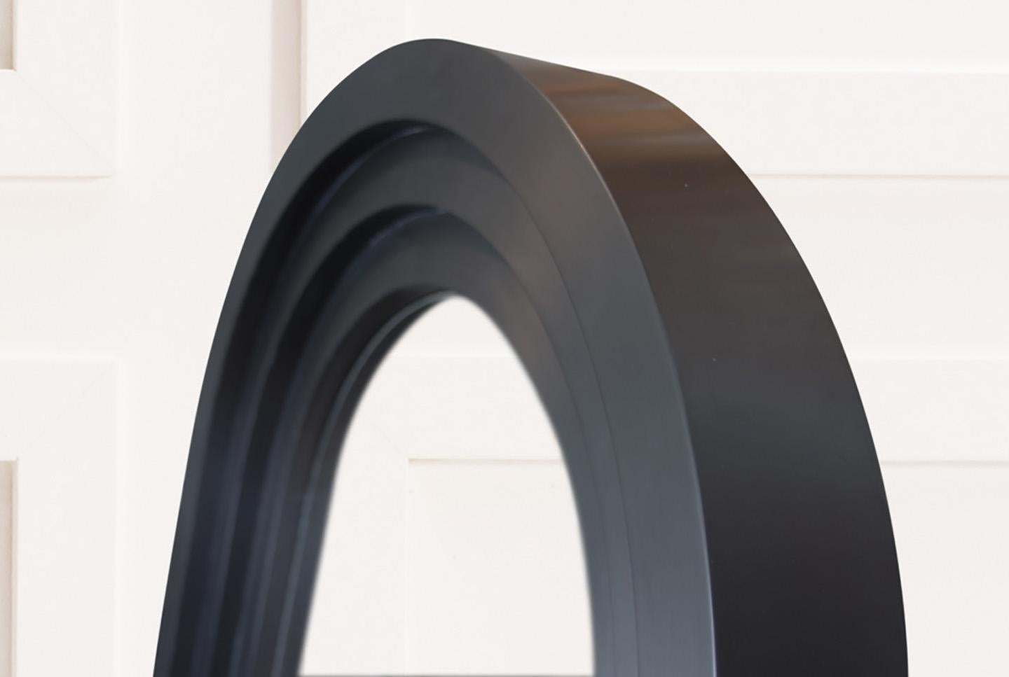 A multi-tiered arch, finished in rich satin black, frames a large mirror. Available in custom sizes, as well as metal finishes. Please contact us further to discuss any custom options.

Please note lead times for customized orders may vary. Rush