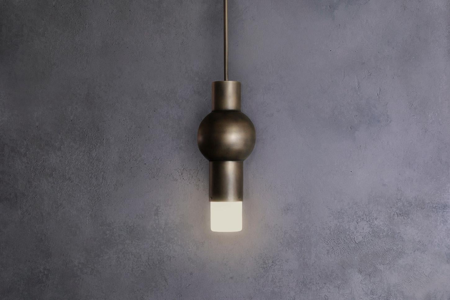 The Lantern pendant presents a finely balanced form with a hand-finished antique brass patina accompanied by a frosted glass diffuser. The Lantern Pendant provides a warm glow and a unique moment of interest wherever it is placed.

Materials: