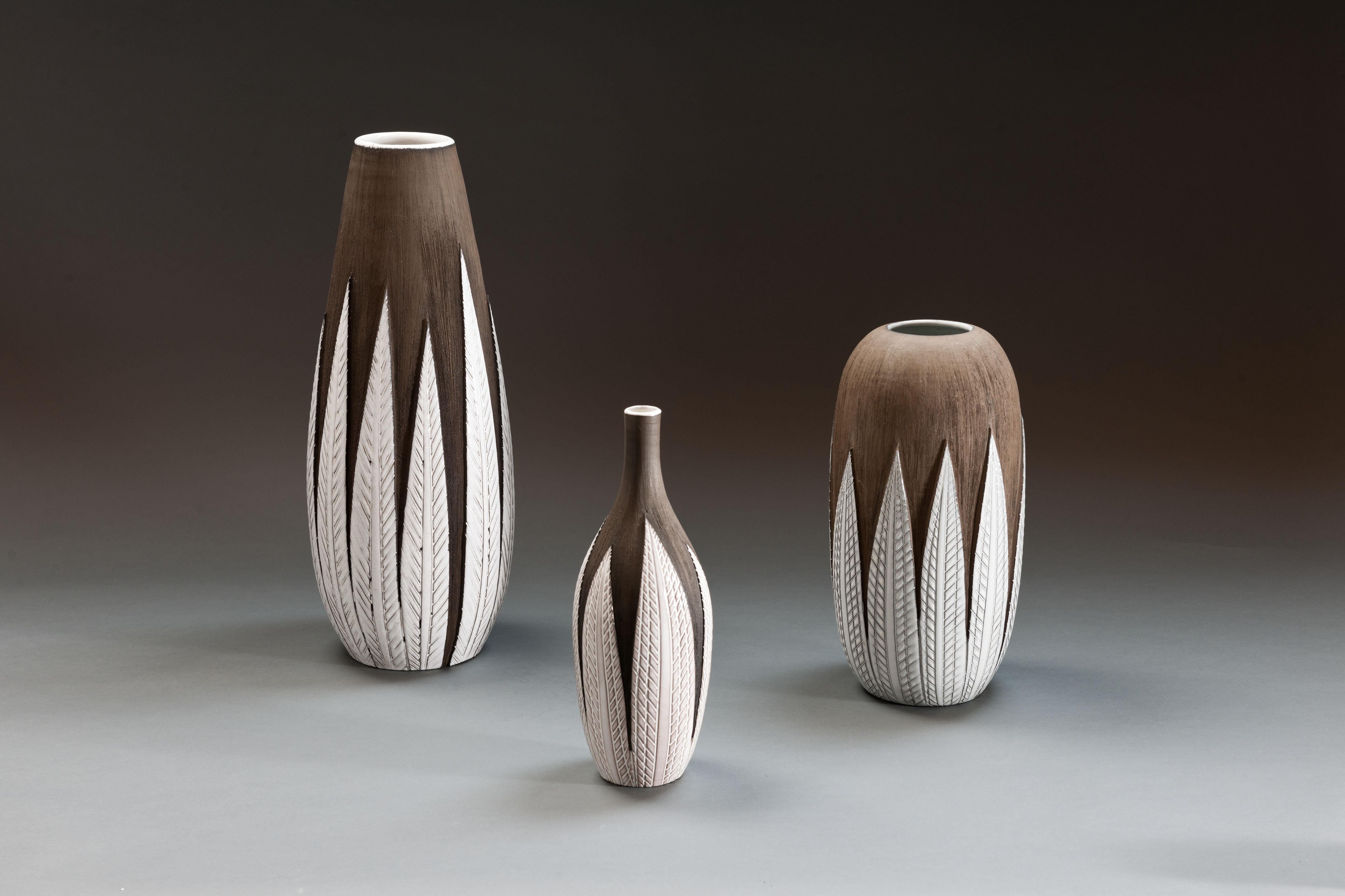 Set of 3 large vintage ceramic 'Paprika' vases by Swedish designer Anna-Lisa Thomson. Unglazed dark brown textured ceramic covered with contrasting glazed leaves.

Thomson designed the 'Paprika series' in 1948-51 for the ceramics company Upsala