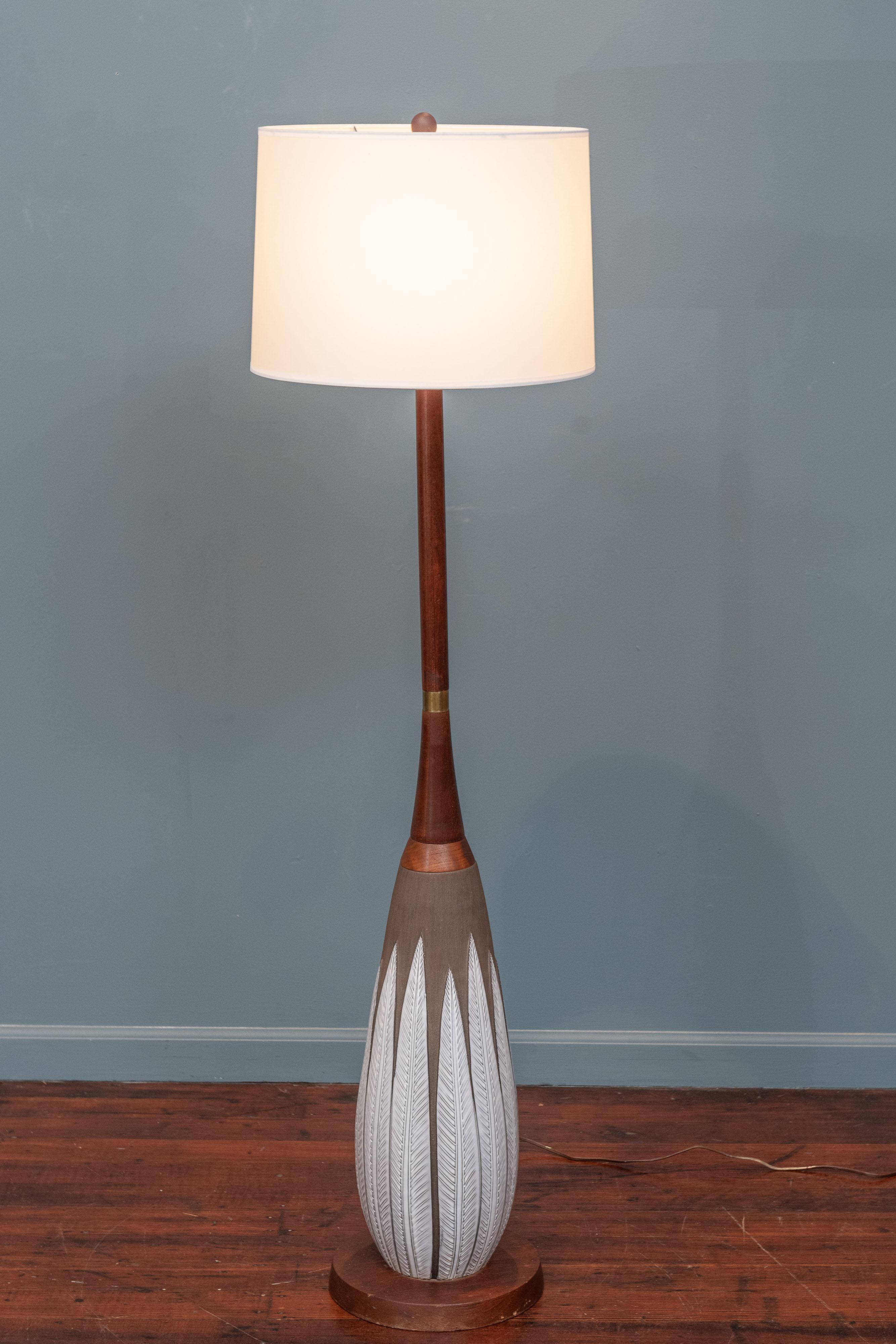 Rare and elegant floor lamp designed by Anna-Lisa Thomson for the Swedish ceramics manufacturer Upsala Ekeby, in the Paprika pattern produced between 1951-1953. The ceramic has a dark brown matte texturized finish with long white glazed leaves. Base