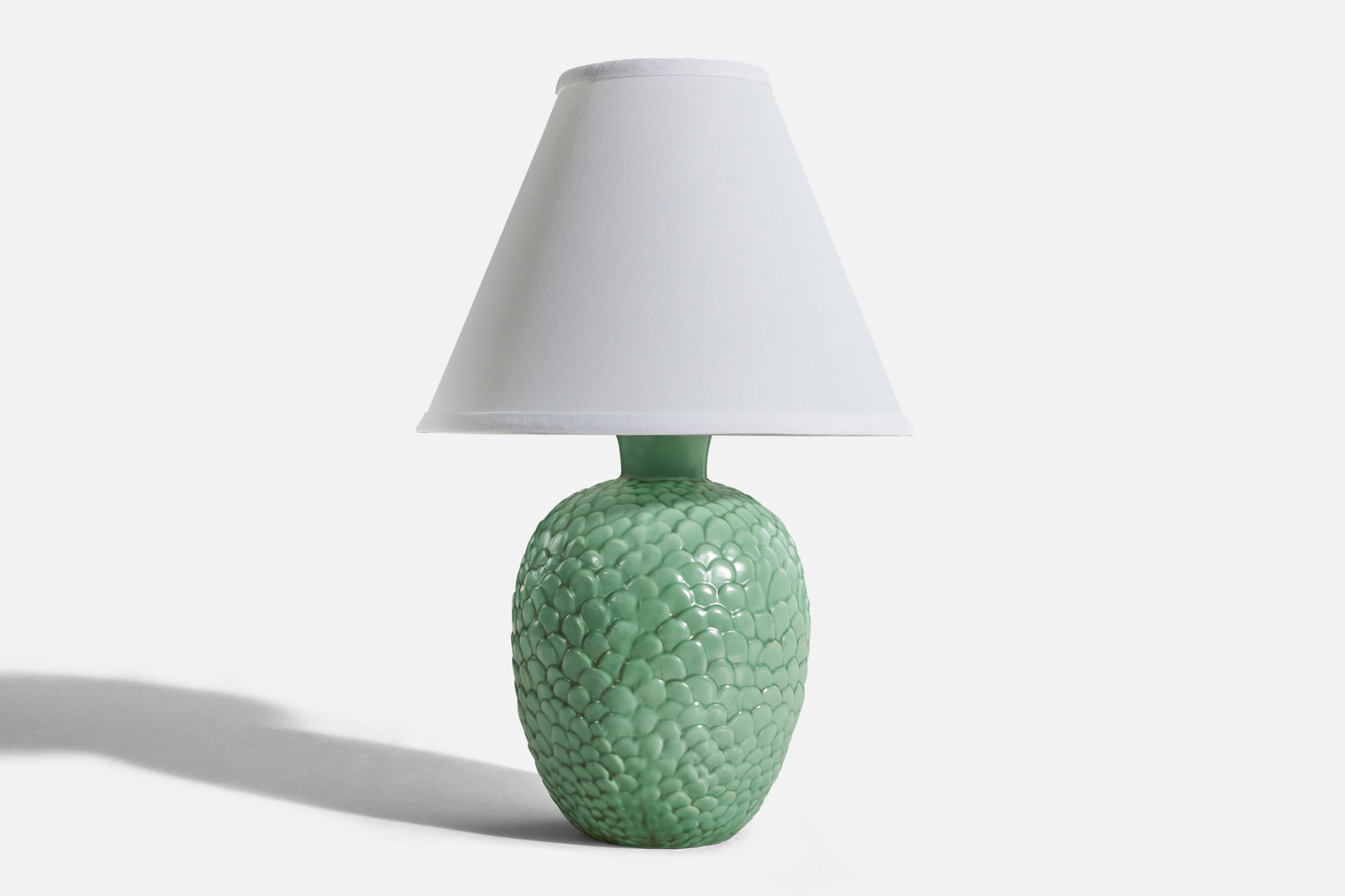 A green, glazed ceramic table lamp designed by Anna-Lisa Thomson and produced by Gefle, Sweden, 1930s. 

Sold without lampshade. 
Dimensions of Lamp (inches) : 11.62 x 6.5 x 6.5 (H x W x D)
Dimensions of Shade (inches) : 4.25 x 10.25 x 8(T x B x
