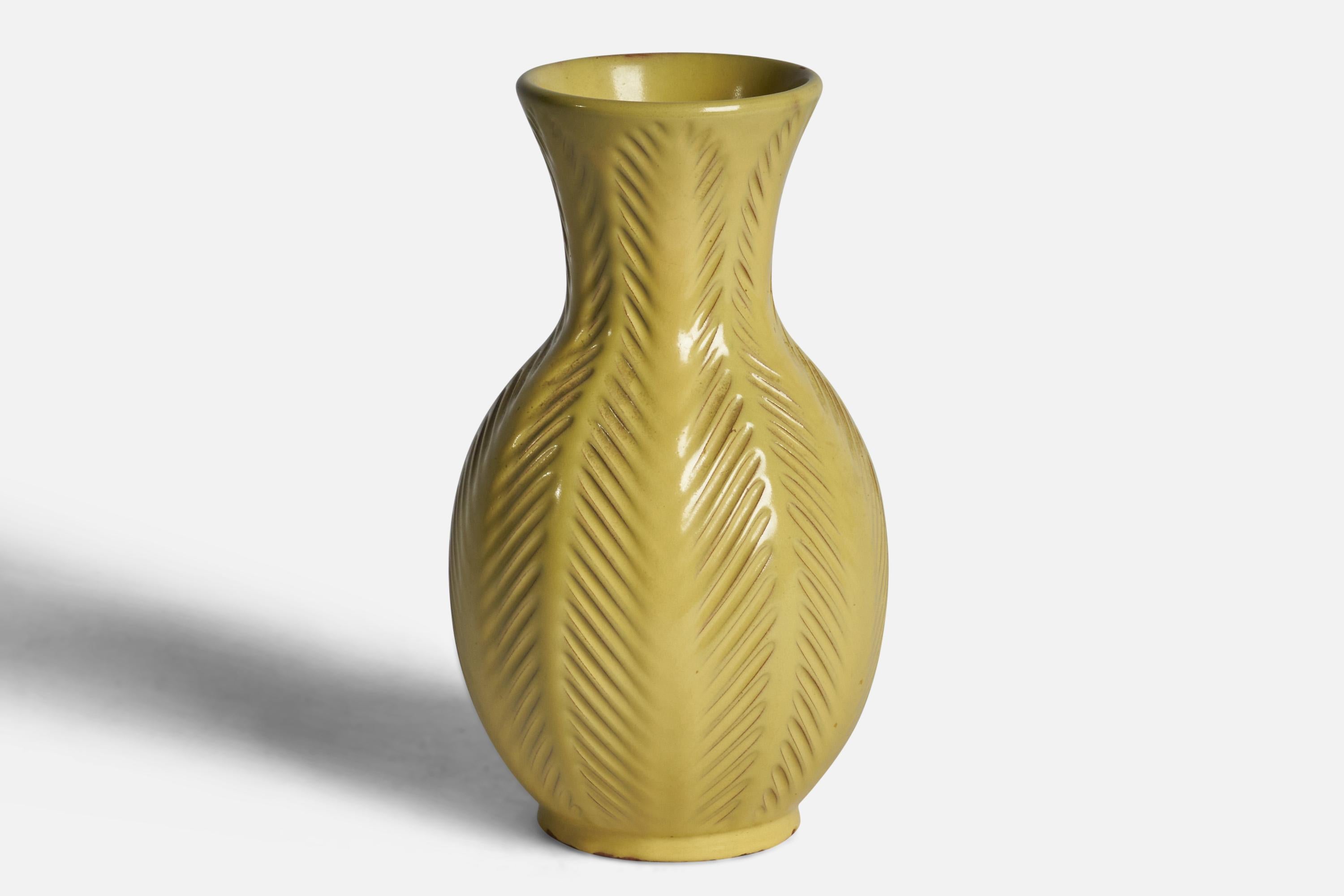 A yellow-glazed incised earthenware vase designed by Anna-Lisa Thomson and produced by Upsala Ekeby, Sweden, 1930s.