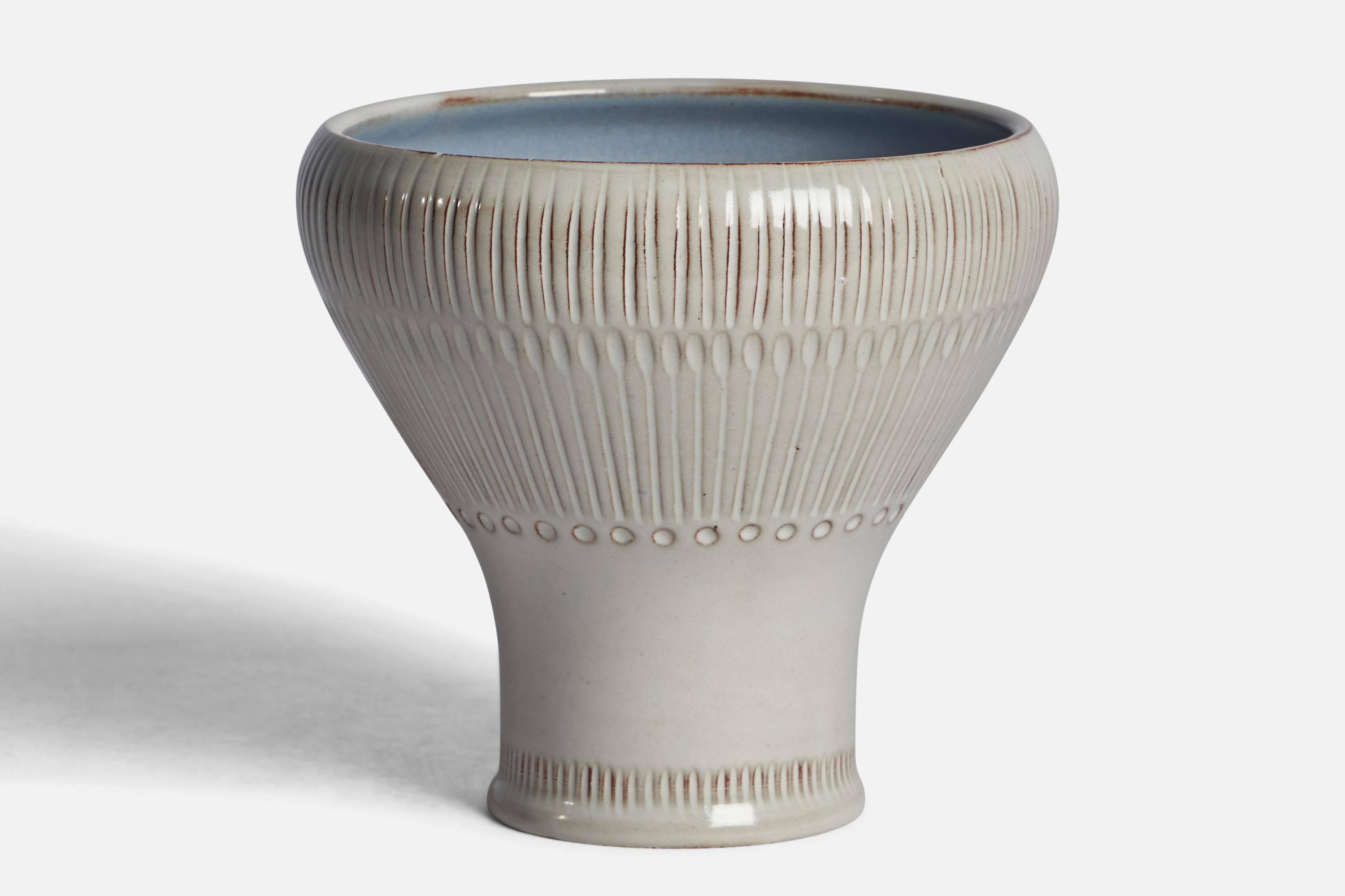 A white and blue-glazed earthenware vase designed by Anna-Lisa Thomson and produced by Upsala Ekeby, Sweden, 1930s.
Old reference #: 397