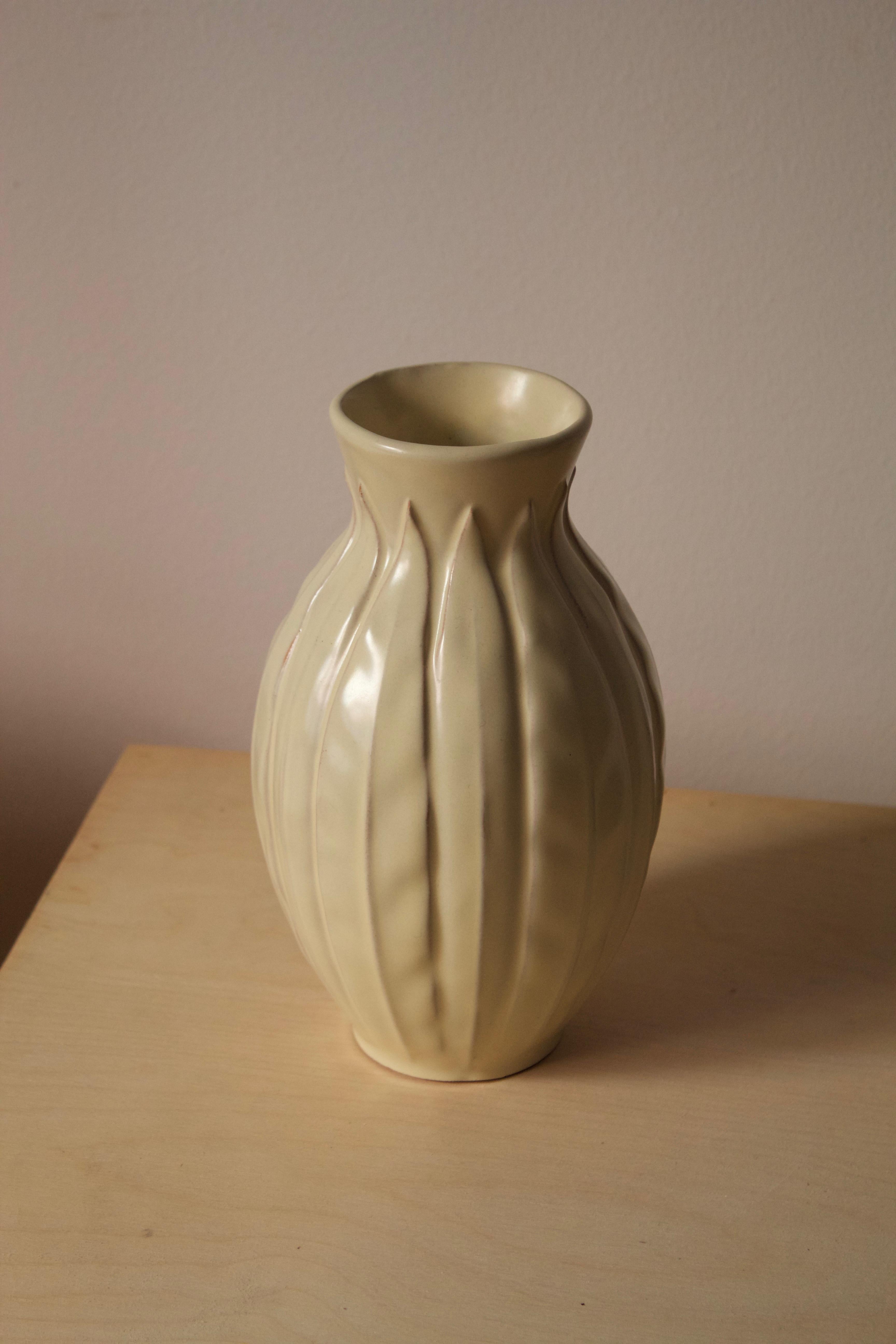An early modernist vase. Designed by Anna-Lisa Thomson, for Upsala-Ekeby, Sweden, 1940s. 

Other designers of the period include Ettore Sottsass, Carl Harry Stålhane, Lisa Larsson, Axel Salto, and Arne Bang.