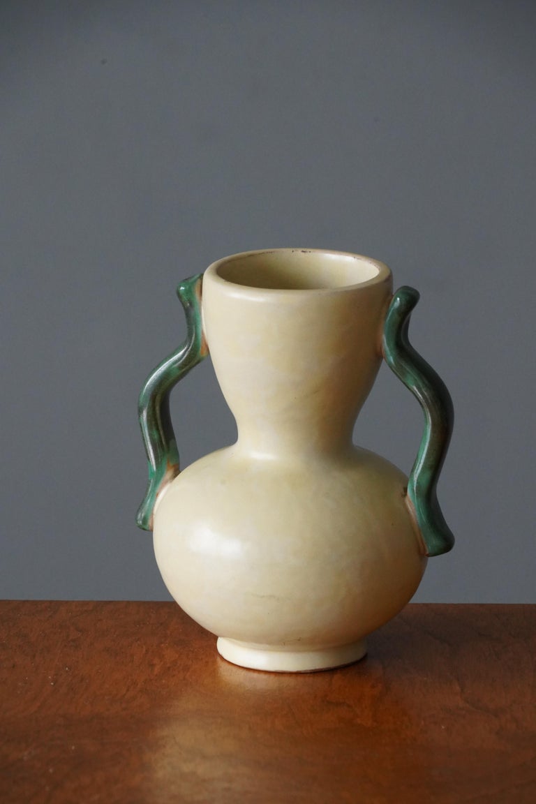 An early modernist vase. Designed by Anna-Lisa Thomson, for Upsala-Ekeby, Sweden, 1940s. Signed.

Other designers of the period include Ettore Sottsass, Carl Harry Stålhane, Lisa Larsson, Axel Salto, and Arne Bang.