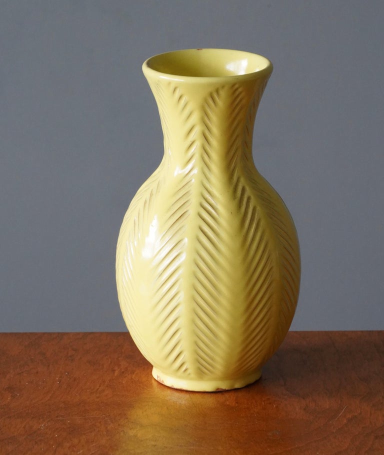An early modernist vase. Designed by Anna-Lisa Thomson, for Upsala-Ekeby, Sweden, 1940s. Signed. In organic and fluted form.

Other designers of the period include Ettore Sottsass, Carl Harry Stålhane, Lisa Larsson, Axel Salto, and Arne Bang.