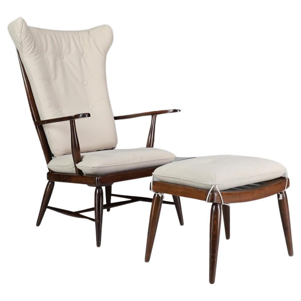 Here is a beautiful and stunning Mid Century Modern armchair or lounge chair with ottoman from solid walnut by Anna Lülja Praun, circa 1952 Austria. This is an exquisite set that can go in many different directions with any design space. A