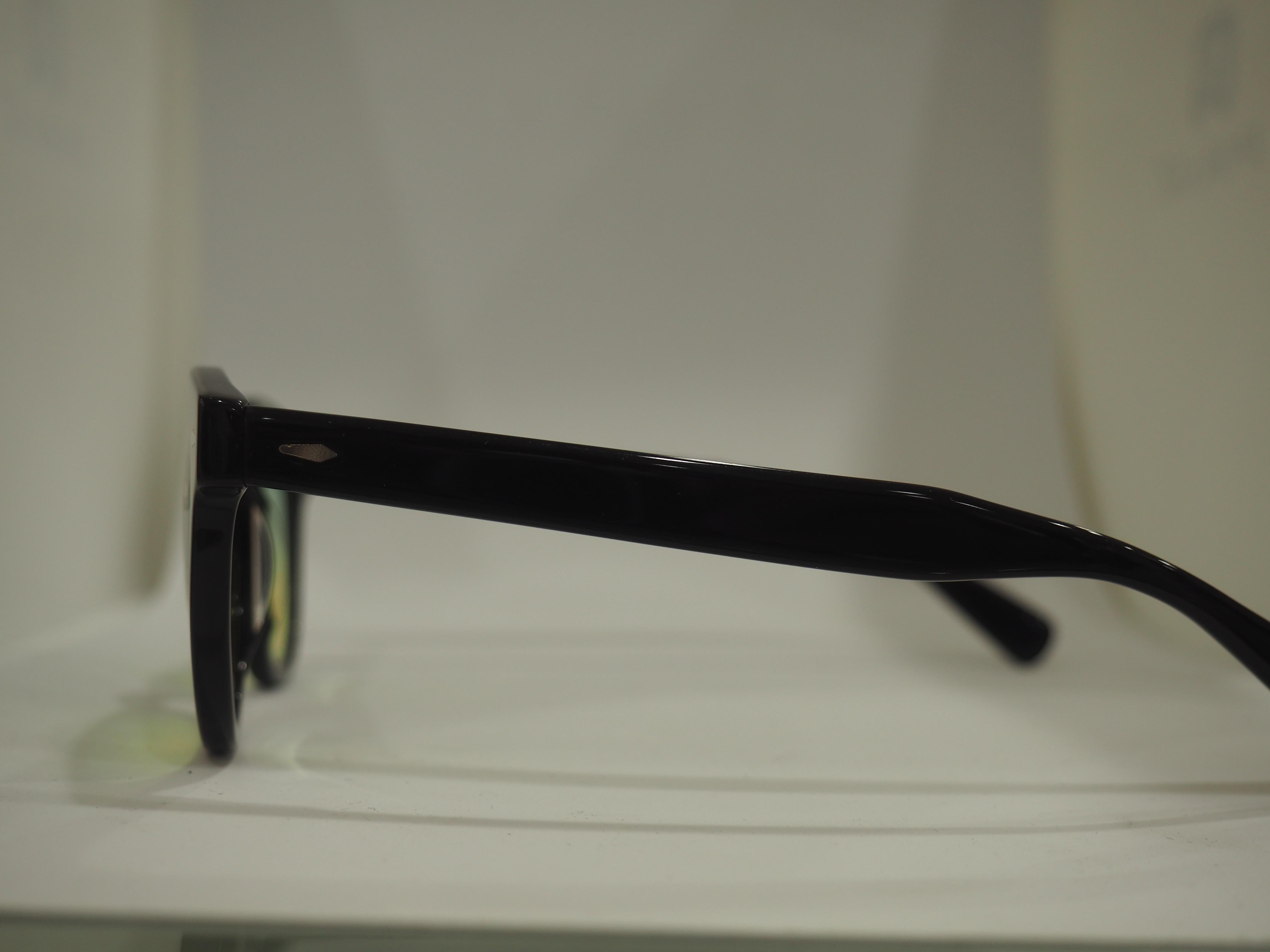 Black Anna Maria Brunelli bicolour lens sunglasses