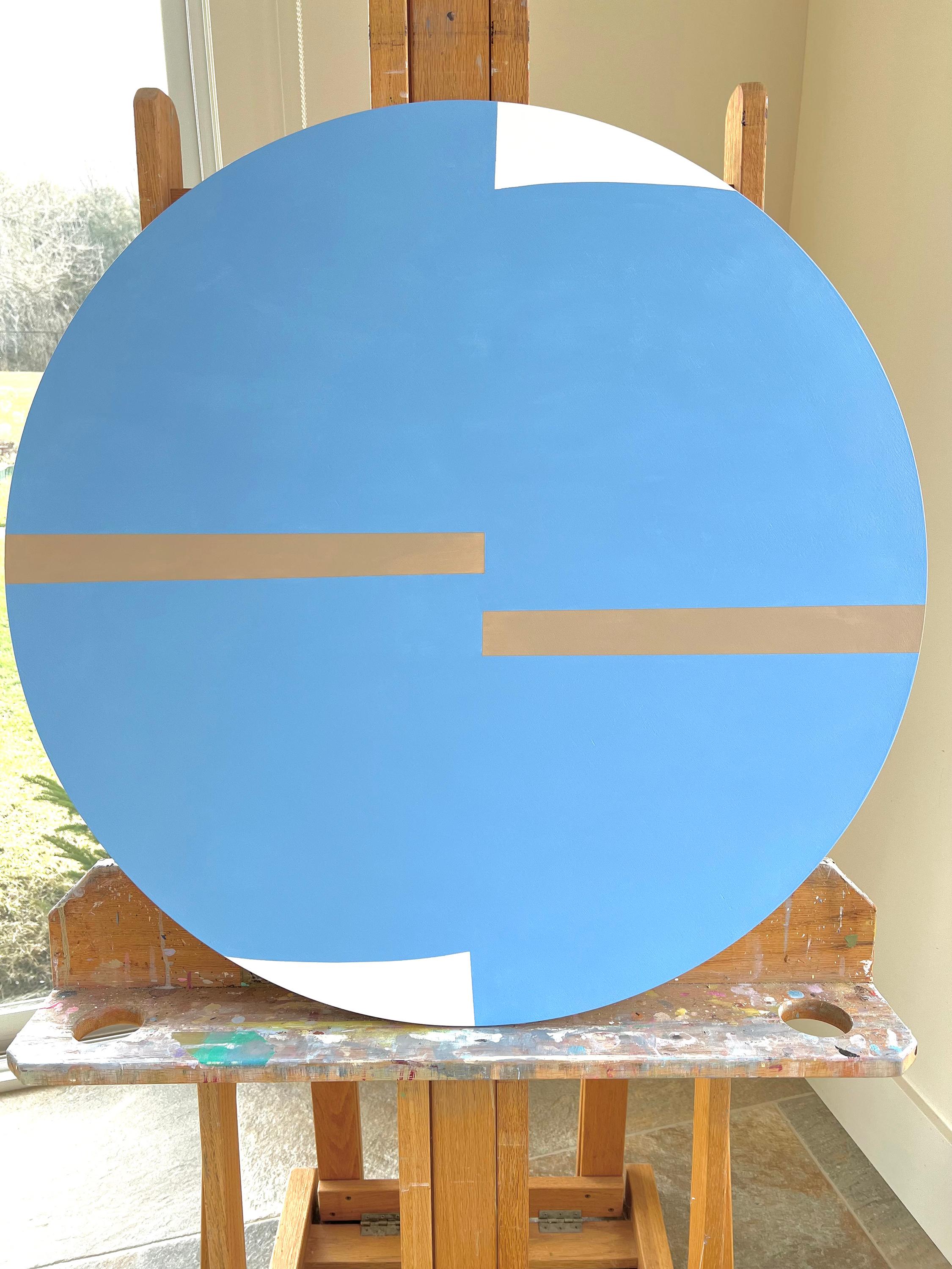An abstract painting of a round shape, made in blue, creates a serene atmosphere reminiscent of the limitless sky. Its clean, geometric style lends a contemporary feel while giving the artwork a sense of structure and balance. With its soothing