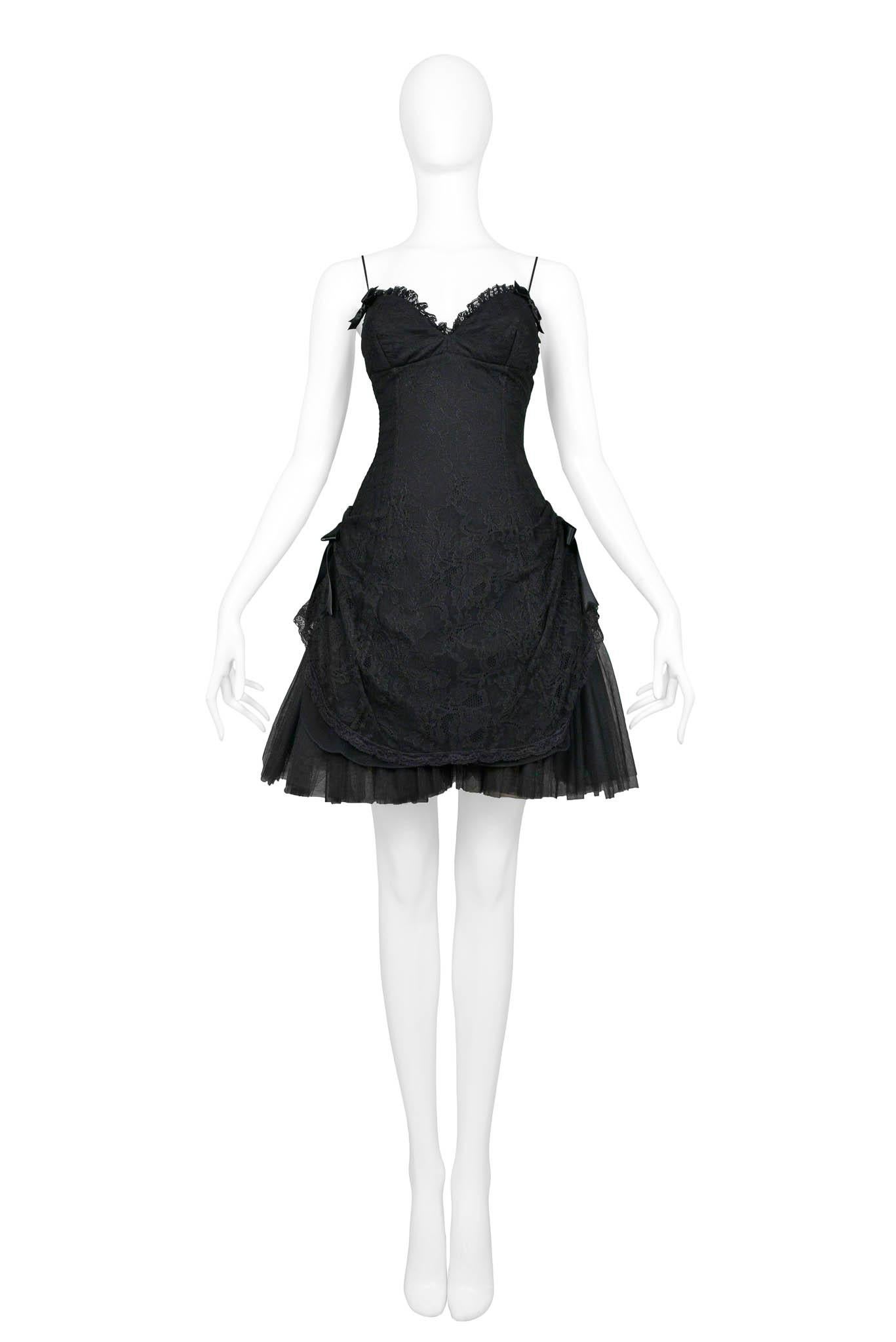 Resurrection Vintage is excited to offer a vintage Anna Molinari black party dress featuring skinny straps, gatherings at the hips, lace detailing, and black bow accents. 

Anna Molinari
Size: 42
Lace & Tulle
Excellent Vintage Condition
Authenticity