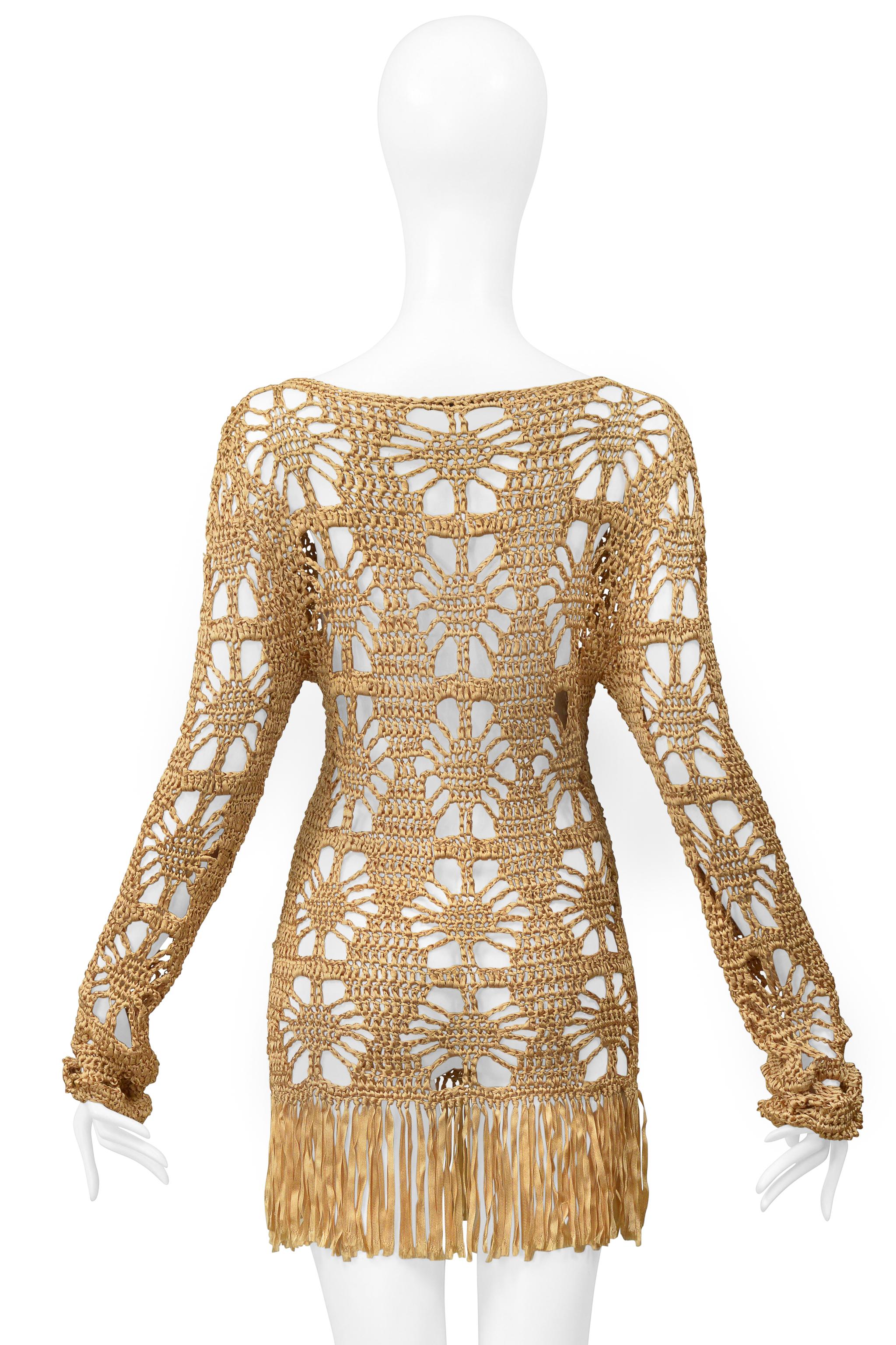 Resurrection Vintage is thrilled to present a vintage Anna Molinari gold ribbon dress made in Italy. The dress features a crocheted body, long sleeves, a fringed hem, and a mini dress length. 
* Anna Molinari
* Size: M
* Fabric: 100% Rayon
*