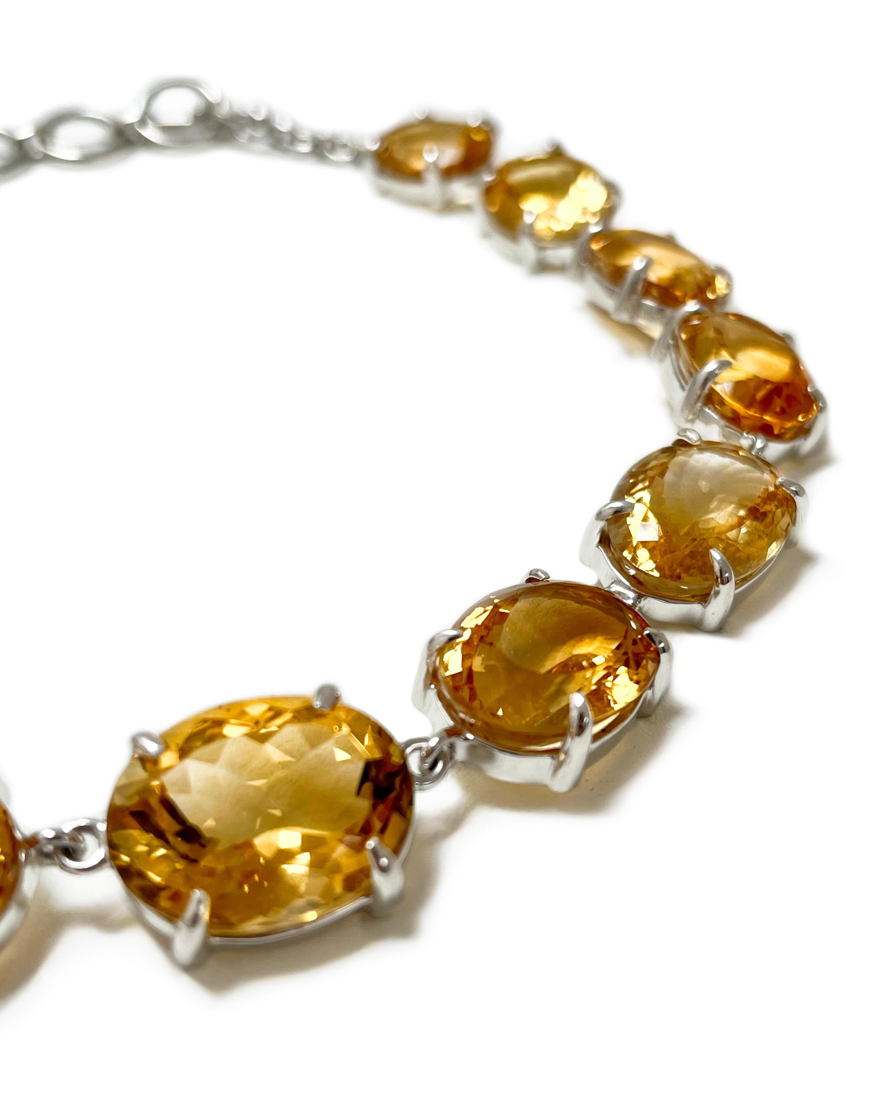 Intention: Like the Sun

Design: You'll radiate brightness and warmth wearing this jewel-forward necklace. Large graduated citrine stones wrap your neckline and secure with a toggle clasp. Set in Argentium silver, so you won't have to worry about
