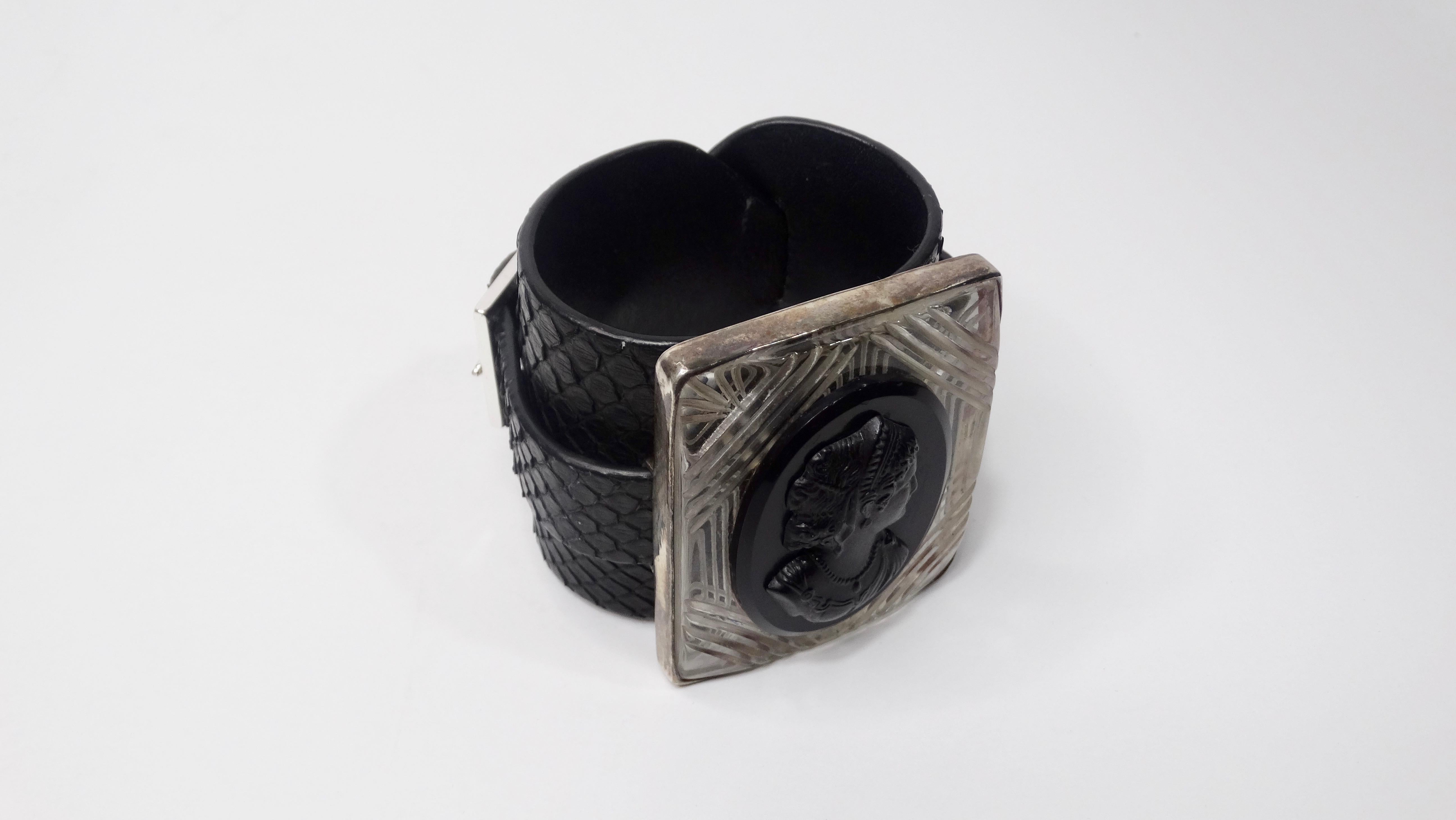 Elevate your look with this amazing Anna Porcu cuff! Circa 1990s, this black python cuff features etched lucite with a high relief cameo of a woman on black agate. Cuff has buckle closure and is stamped Anna Porcu Italy inside. Timeless and chic,